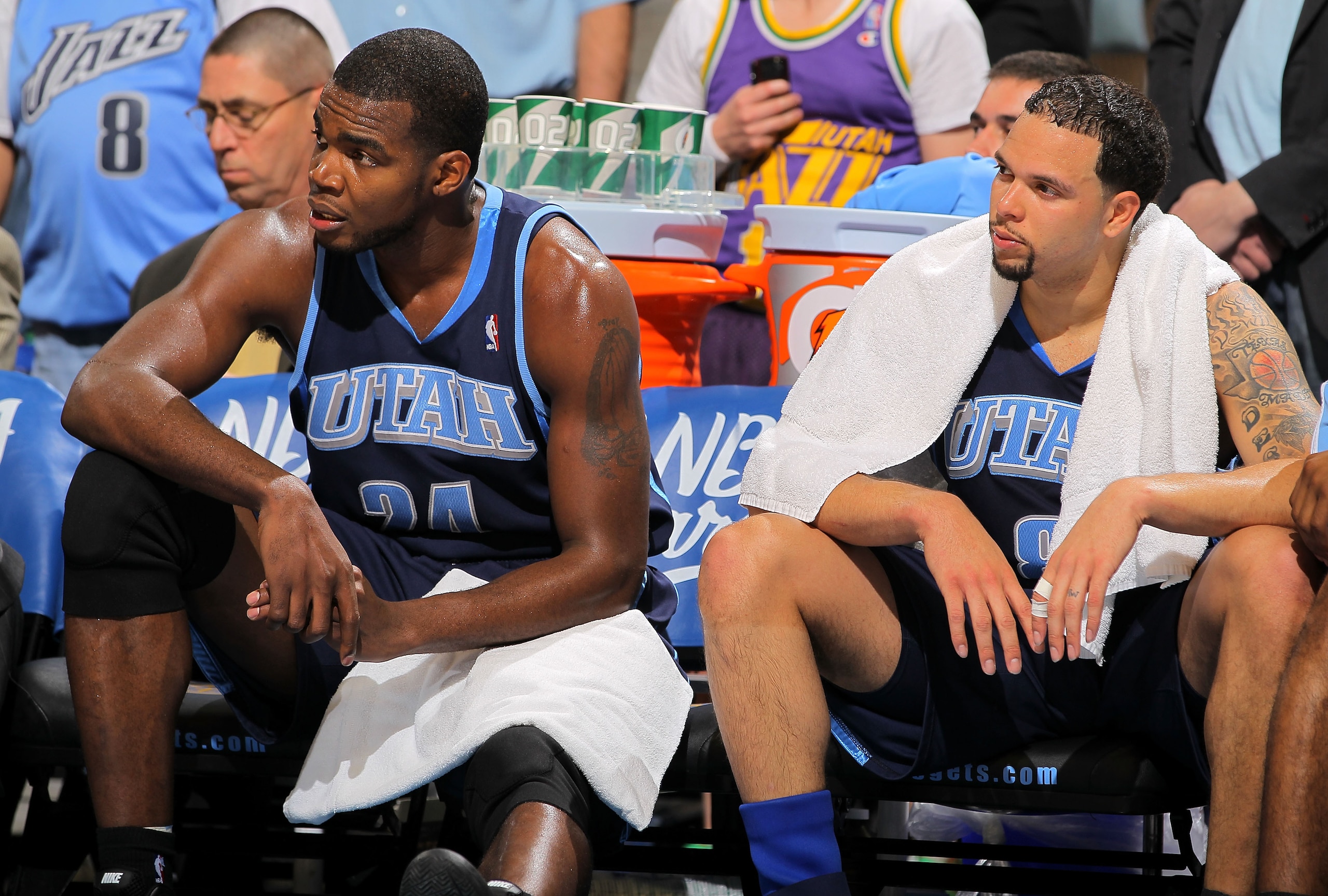 DENVER - APRIL 28:  Paul Millsap #24 and Deron Williams #8 of the Utah Jazz sit on the bench in the closing minutes against the Denver Nuggets in Game Five of the Western Conference Quarterfinals of the 2010 NBA Playoffs at the Pepsi Center on April 28, 2
