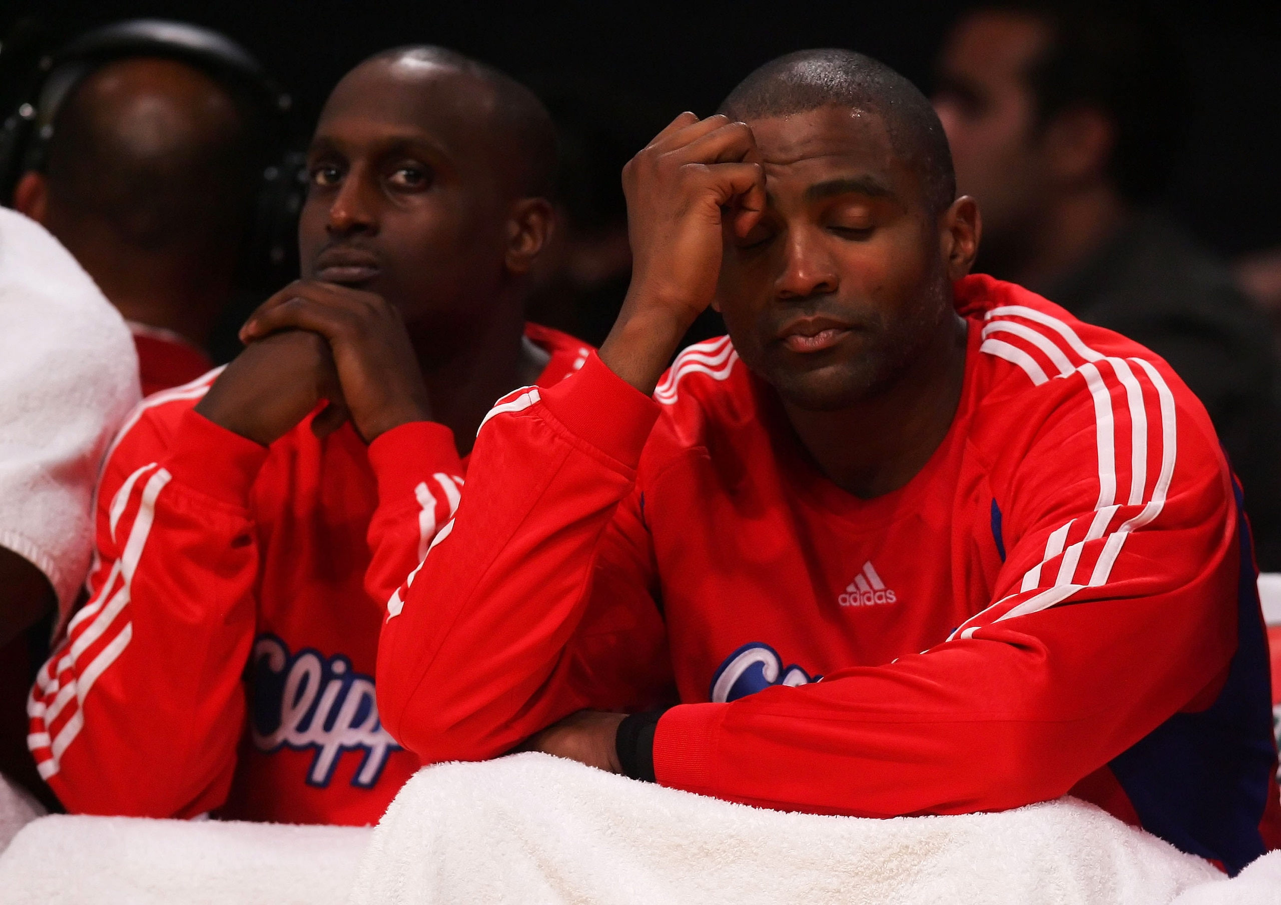 LOS ANGELES, CA - MARCH 07:  Brevin Knight (L) #22 and Cuttino Mobley #5 of the Los Angeles Clippers look dejected on the bench during the fourth quarter against the Los Angeles Lakers at Staples Center on March 7, 2008 in Los Angeles, California.The Lake