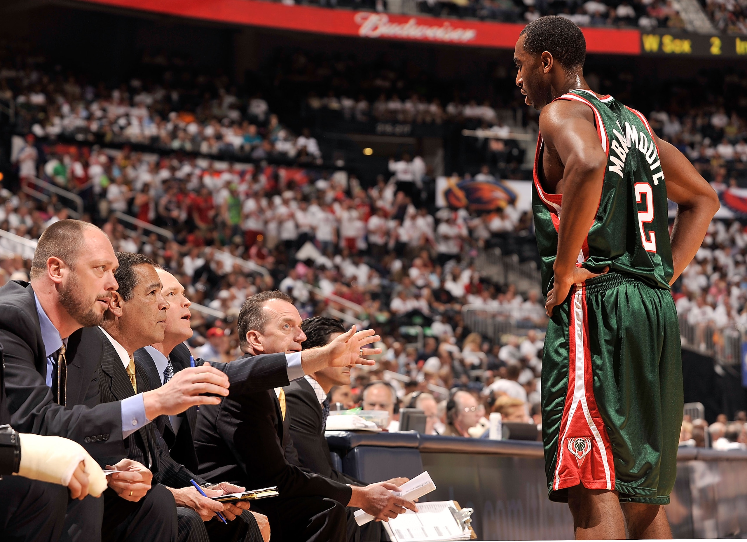 ATLANTA - APRIL 17:  Luc Richard Mbah a Moute #12 of the Milwaukee Bucks confers with the coaching staff during a 102-92 loss to the Atlanta Hawks during Game One of the Eastern Conference Quarterfinals of the 2010 NBA Playoffs at Philips Arena on April 1