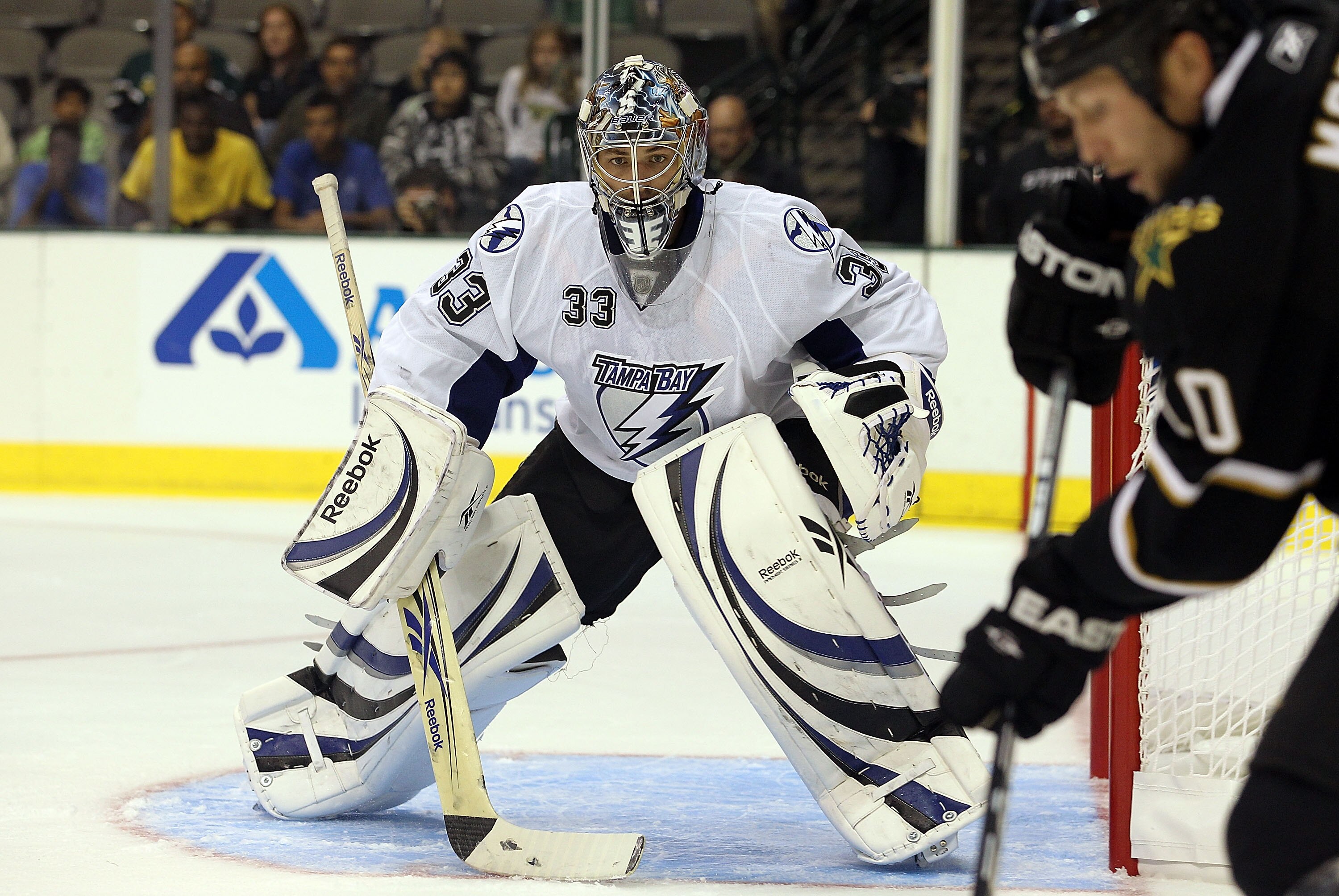 DALLAS - SEPTEMBER 21:  Goaltender Dan Ellis #33 of the Tampa Bay Lightning in goal against Brenden Morrow #10 of the Dallas Stars during a preseason game at American Airlines Center on September 21, 2010 in Dallas, Texas.  (Photo by Ronald Martinez/Getty