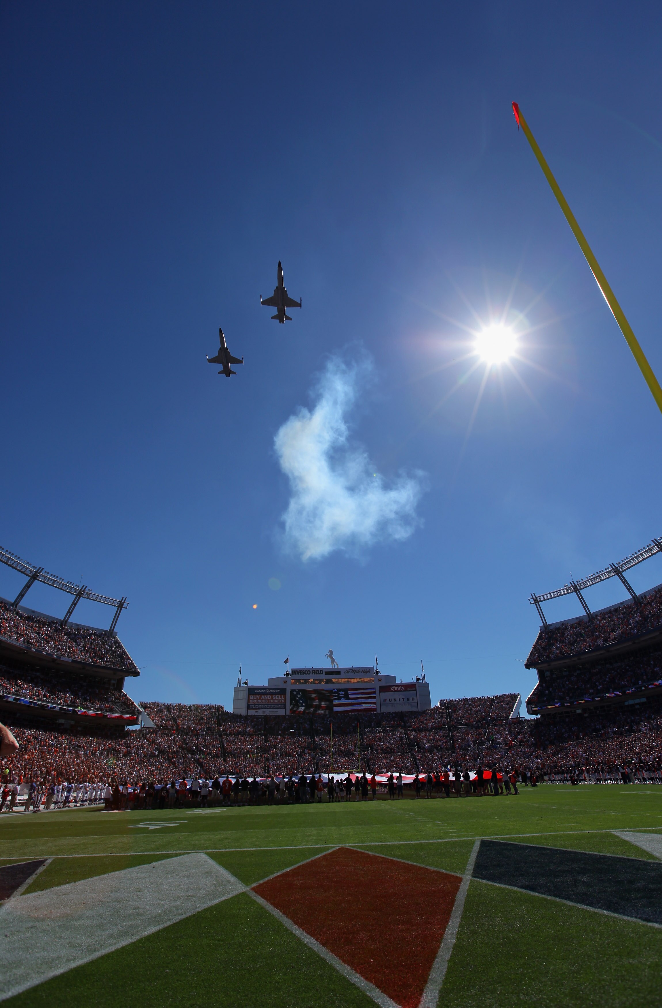 DENVER - SEPTEMBER 26:  US Military jets perform a flyover during pregame ceremonies as the Denver Broncos host the Indianapolis Colts at INVESCO Field at Mile High on September 26, 2010 in Denver, Colorado. The Colts defeated the Broncos 27-13.  (Photo b