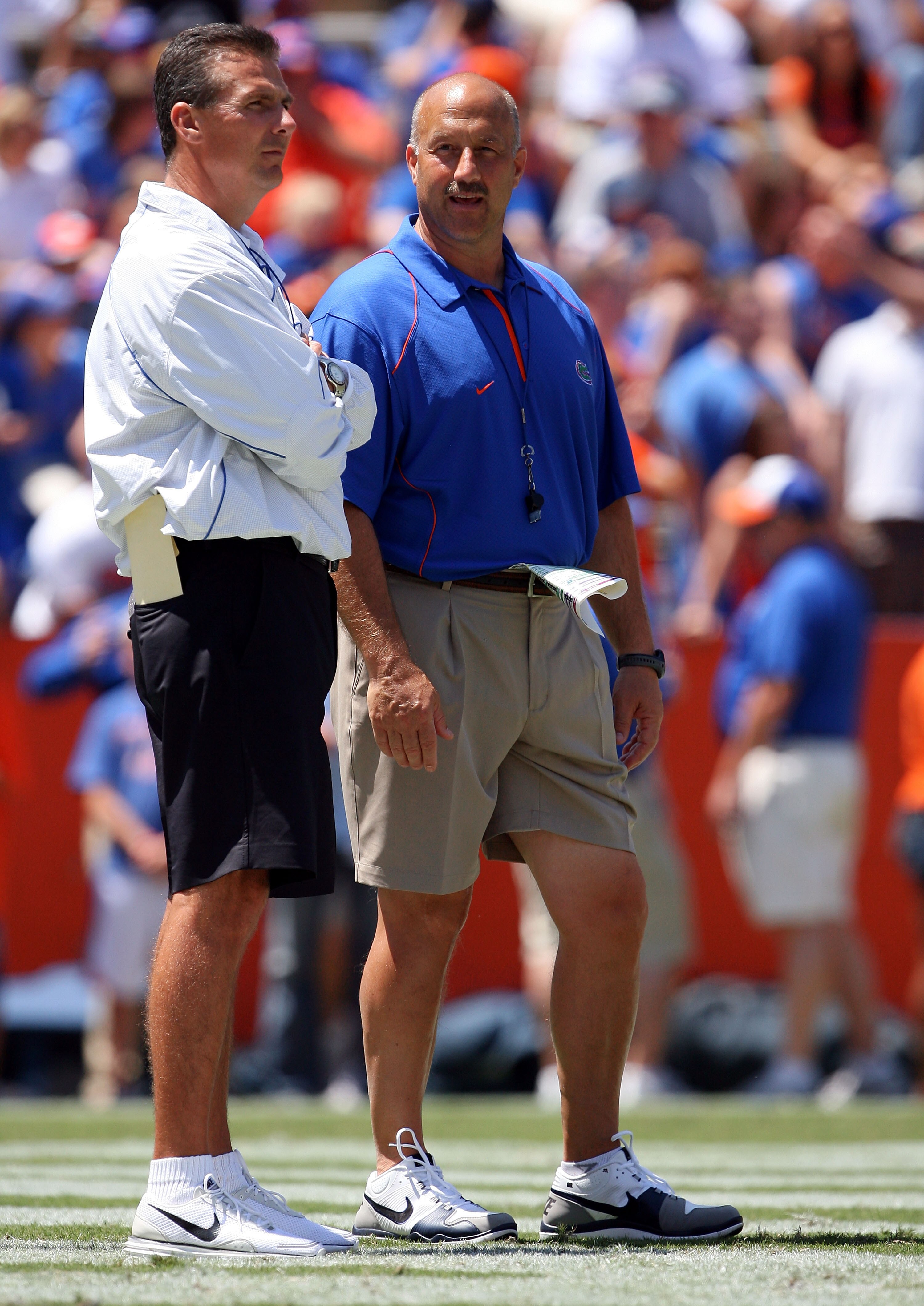 GAINESVILLE, FL - APRIL 10:  Head coach Urban Meyer of the Florida Gators talks with offensive coordinator Steve Addazio, R, during the Orange & Blue game at Ben Hill Griffin Stadium on April 10, 2010 in Gainesville, Florida.  (Photo by Doug Benc/Getty Im