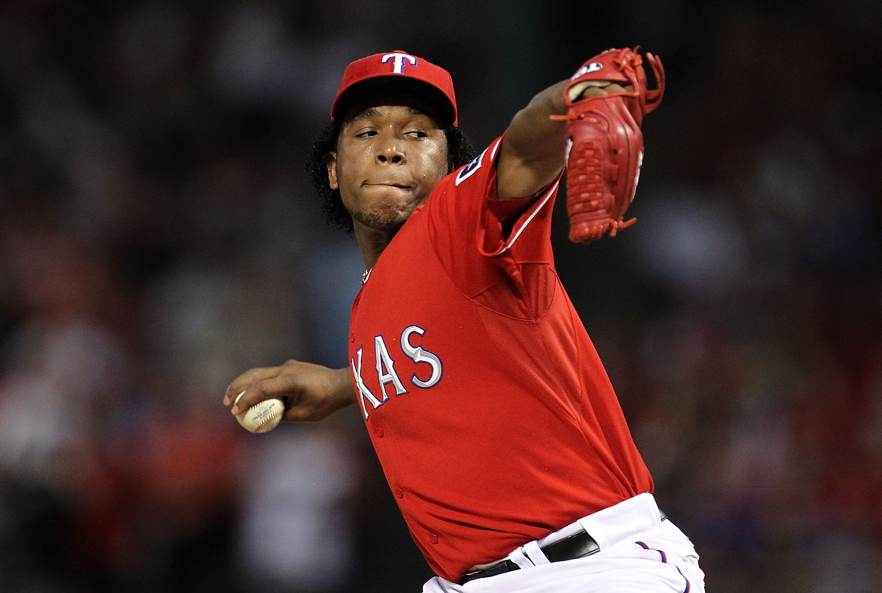 ARLINGTON, TX - OCTOBER 09:  Pitcher Neftali Feliz #30 of the Texas Rangers throws against the Tampa Bay Rays in the 9th inning during game 3 of the ALDS at Rangers Ballpark in Arlington on October 9, 2010 in Arlington, Texas.  (Photo by Ronald Martinez/G