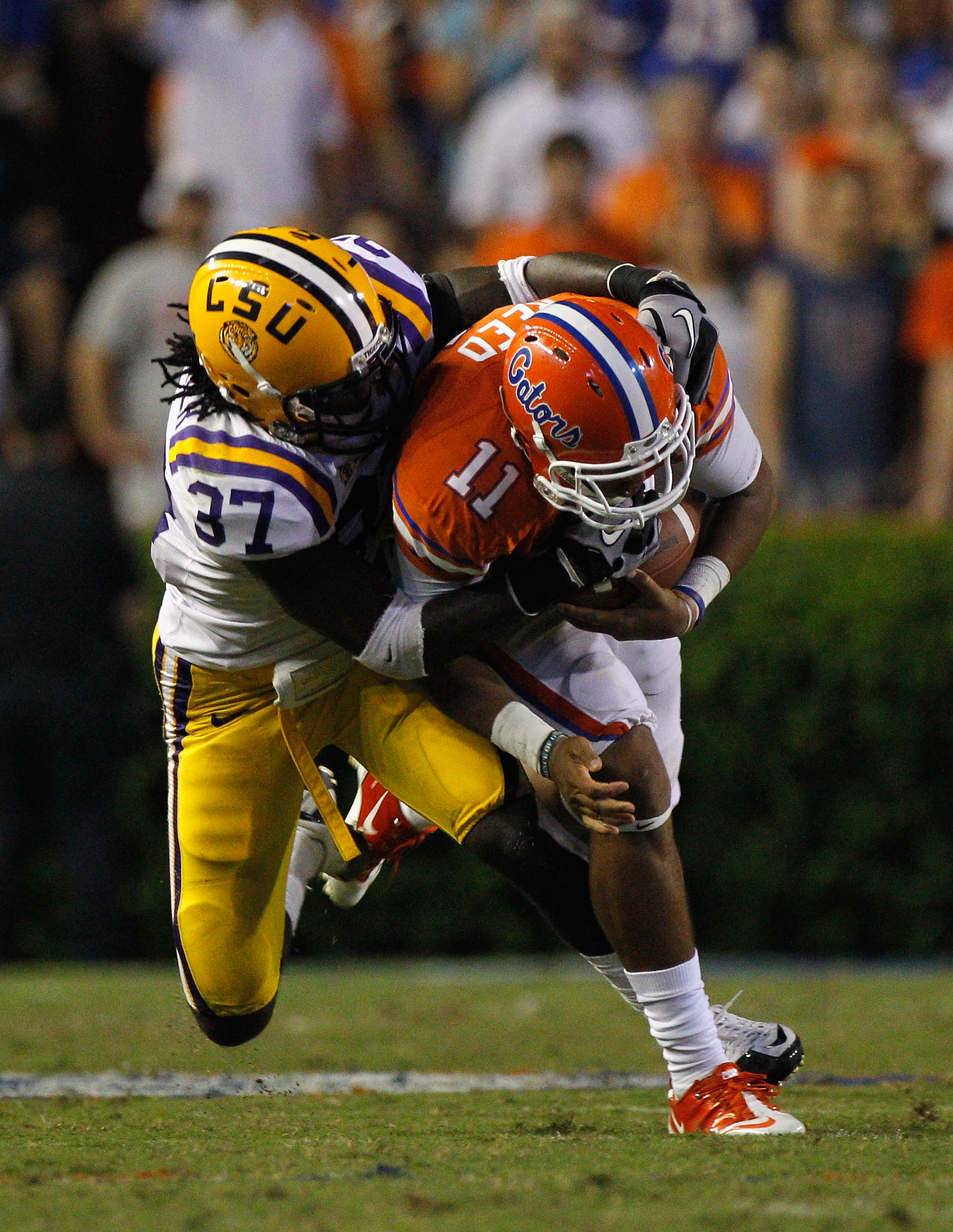 GAINESVILLE, FL - OCTOBER 09:  Karnell Hatcher #37 of the Louisiana State University Tigers tackles Jordan Reed #11 of the Florida Gators during the game at Ben Hill Griffin Stadium on October 9, 2010 in Gainesville, Florida.  (Photo by Sam Greenwood/Gett