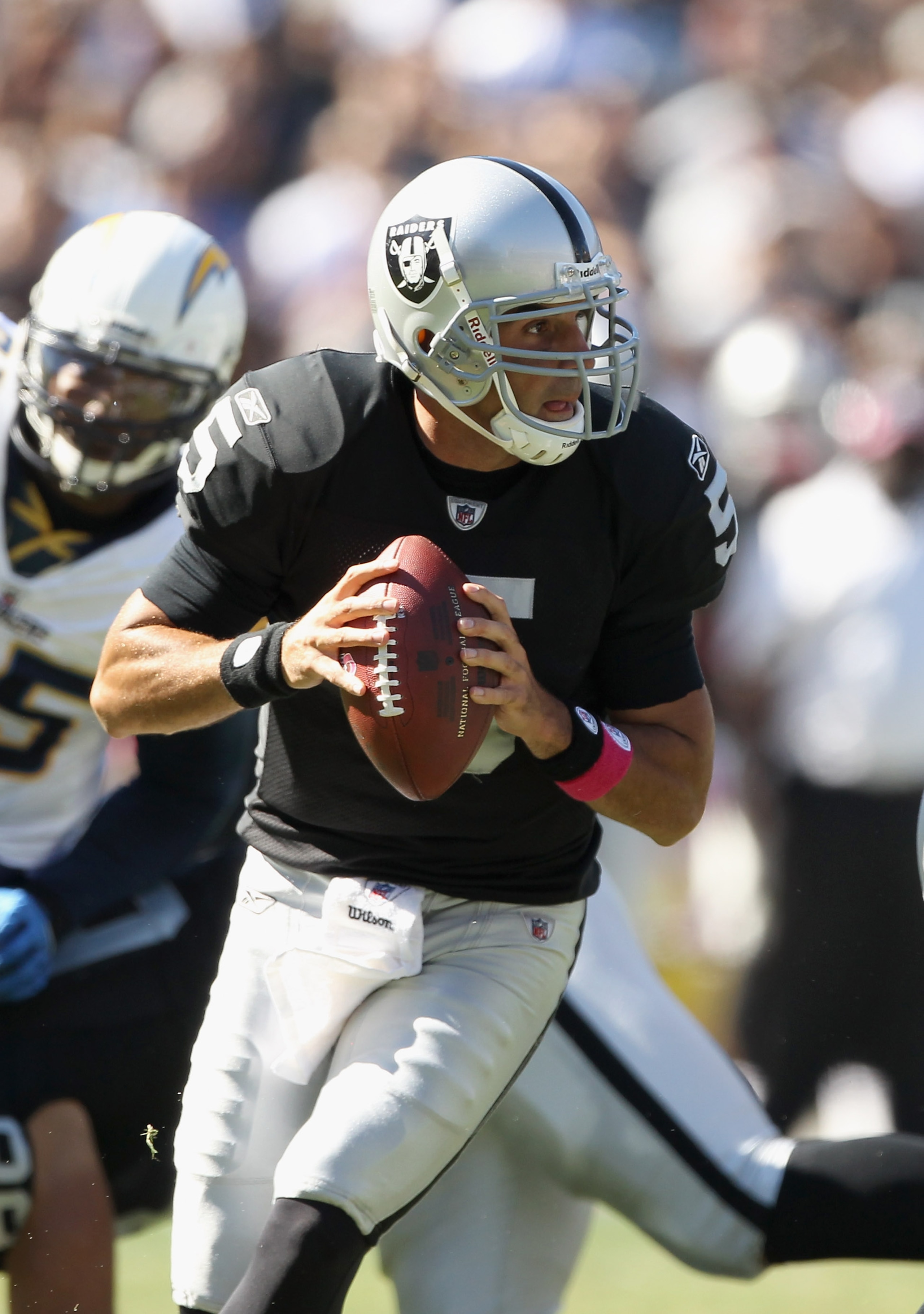OAKLAND, CA - OCTOBER 10: Bruce Gradkowski #5 of the Oakland Raiders passes the ball against the San Diego Chargers at Oakland-Alameda County Coliseum on October 10, 2010 in Oakland, California. (Photo by Ezra Shaw/Getty Images) OAKLAND, CA - OCTOBER 10: Bruce Gradkowski #5 of the Oakland Raiders passes the ball against the San Diego Chargers at Oakland-Alameda County Coliseum on October 10, 2010 in Oakland, California. (Photo by Ezra Shaw/Getty Images)