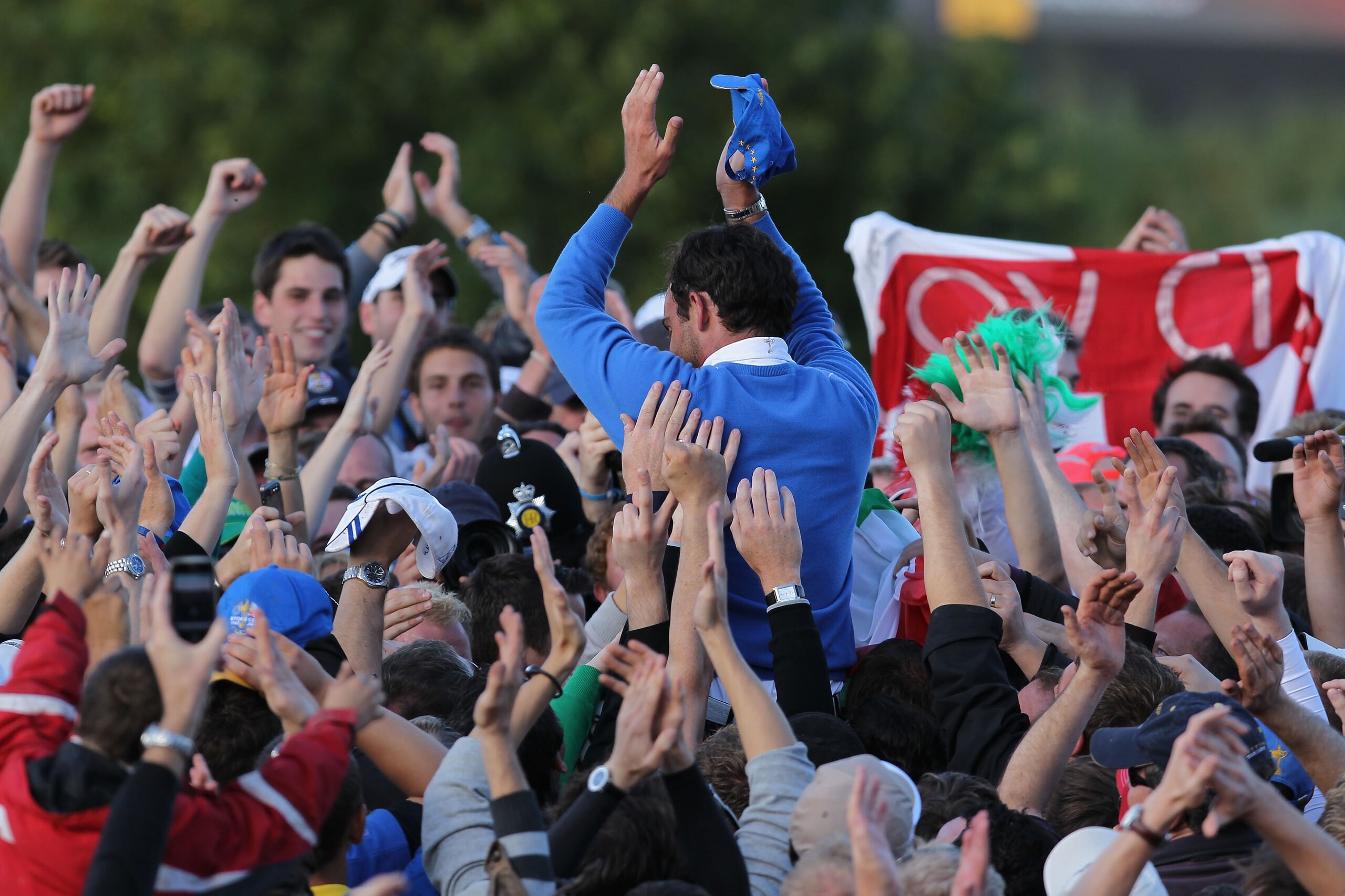 NEWPORT, WALES - OCTOBER 04:  Edoardo Molinari of Europe celebrates his team's victory with supporters at the end of the singles matches during the 2010 Ryder Cup at the Celtic Manor Resort on October 4, 2010 in Newport, Wales.  (Photo by Andy Lyons/Getty