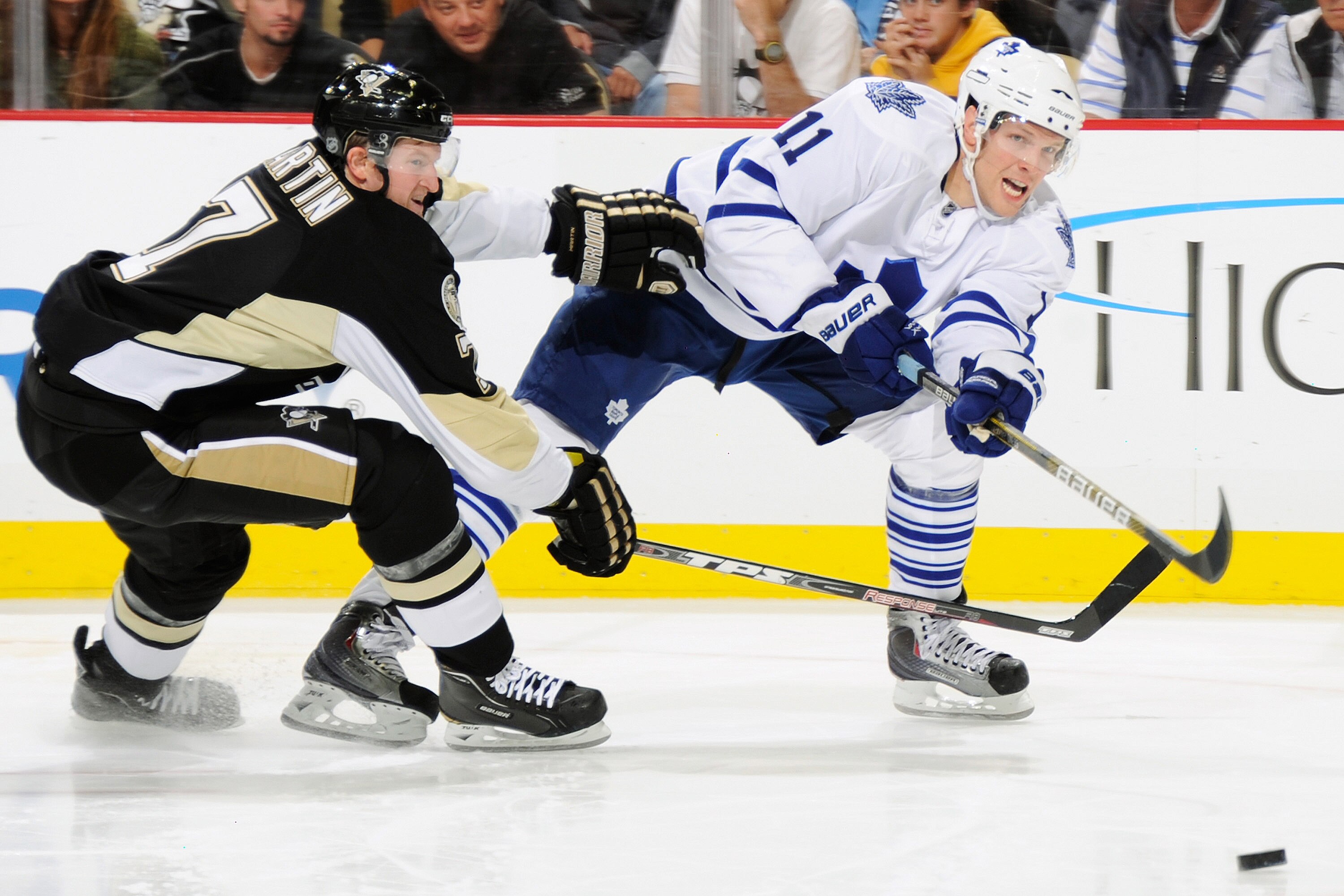 PITTSBURGH - OCTOBER 13:  Fredrik Sjostrom #11 of the Toronto Maple Leafs shoots the puck past Paul Martin #7 of the Pittsburgh Penguins on October 13, 2010 at Consol Energy Center in Pittsburgh, Pennsylvania. Toronto defeated Pittsburgh 4-3.  (Photo by J