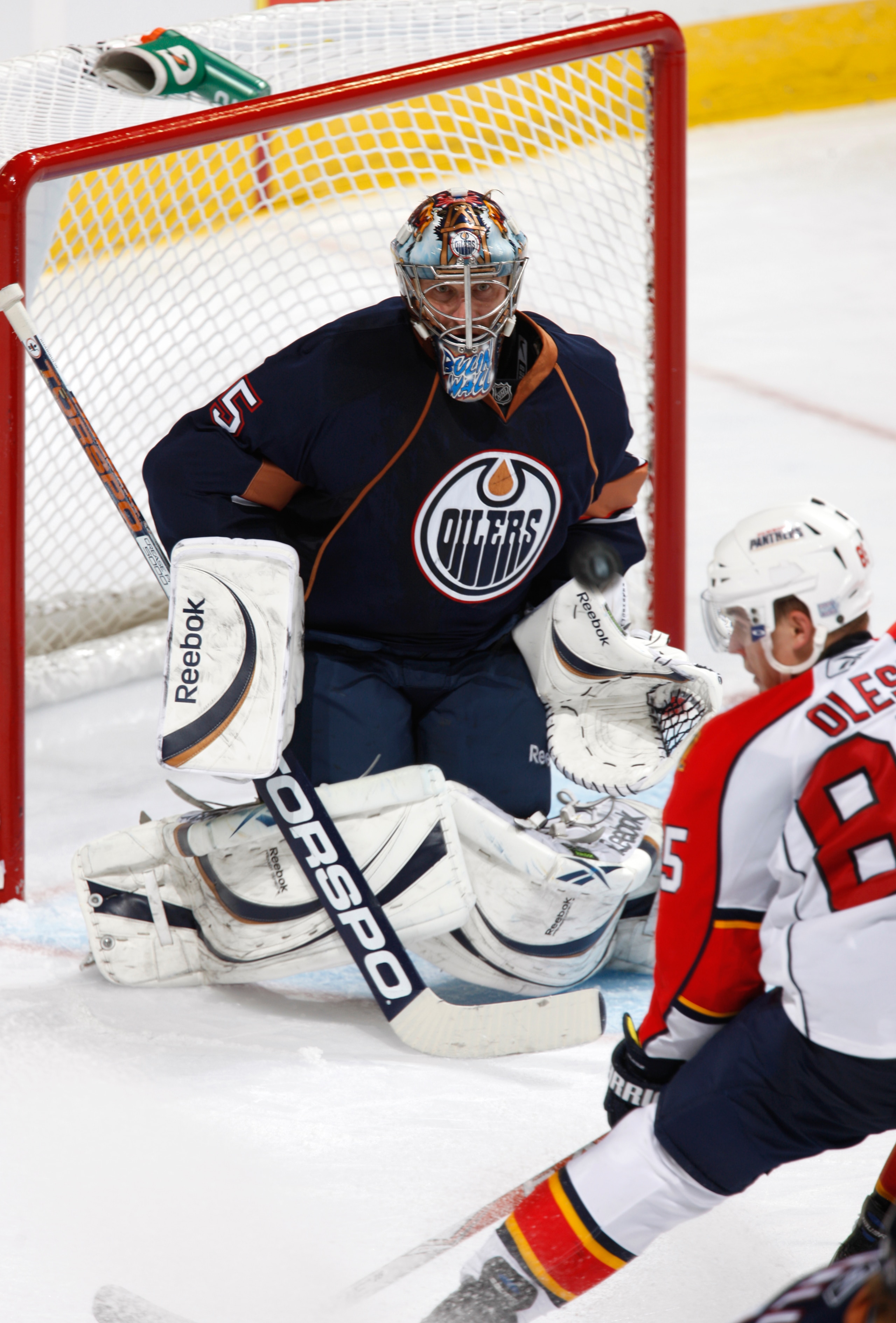 EDMONTON, CANADA - OCTOBER 10: Nik Khabibulin #35 of the Edmonton Oilers makes a save off Rostislaz Olesz #85 of the Florida Panthers in third-period action at Rexall Place October 10, 2010 in Edmonton, Alberta, Canada. (Photo by Dale MacMillan/Getty Ima EDMONTON, CANADA - OCTOBER 10: Nik Khabibulin #35 of the Edmonton Oilers makes a save off Rostislaz Olesz #85 of the Florida Panthers in third-period action at Rexall Place October 10, 2010 in Edmonton, Alberta, Canada. (Photo by Dale MacMillan/Getty Ima