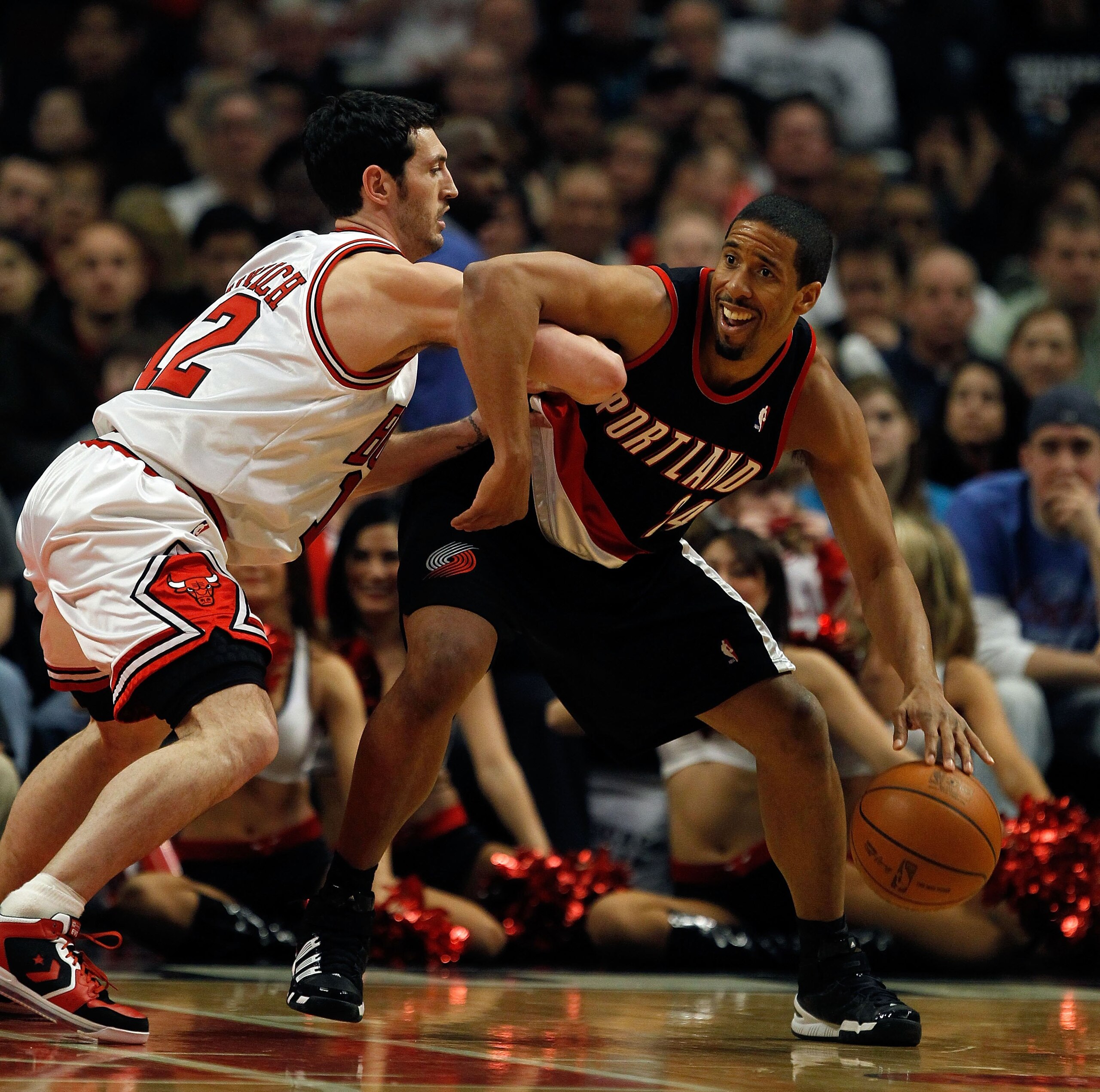 CHICAGO - FEBRUARY 26: Andre Miller #24 of the Portland Trail Blazers tries to move against Kirk Hinrich #12 of the Chicago Bulls at the United Center on February 26, 2010 in Chicago, Illinois. The Bulls defeated the Trail Blazers 115-111 in overtime. NOT