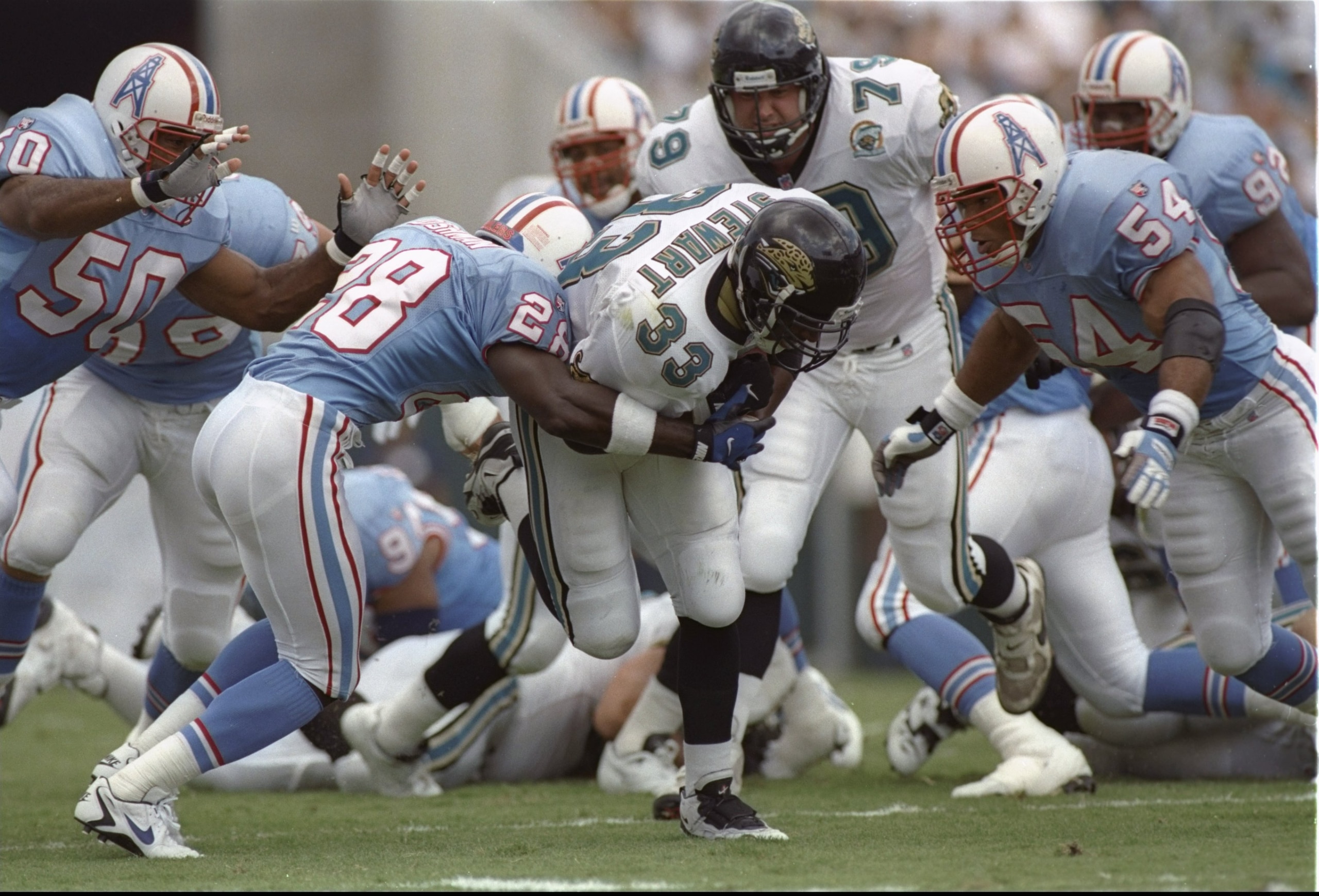 3 Sep 1995:  Running back James Stewart of the Jacksonville Jaguars gets tackled during a game against the Houston Oilers at Jacksonville Stadium in Jacksonville, Florida.  The Oilers won the game, 10-3. Mandatory Credit: Doug Pensinger  /Allsport