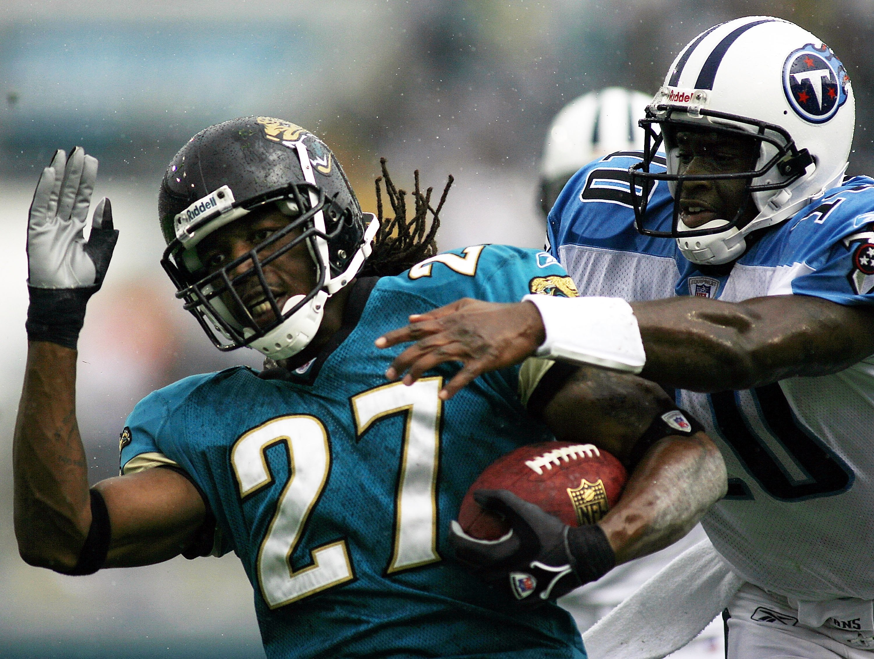 JACKSONVILLE, FL - NOVEMBER 05:  Defensive Back Rashean Mathis #27 of the Jacksonville Jaguars is tackled by quarterback Vince Young #10 of the Tennessee Titans after Mathis intercepted the ball November 5, 2006 at Alltel Stadium in Jacksonville, Florida.