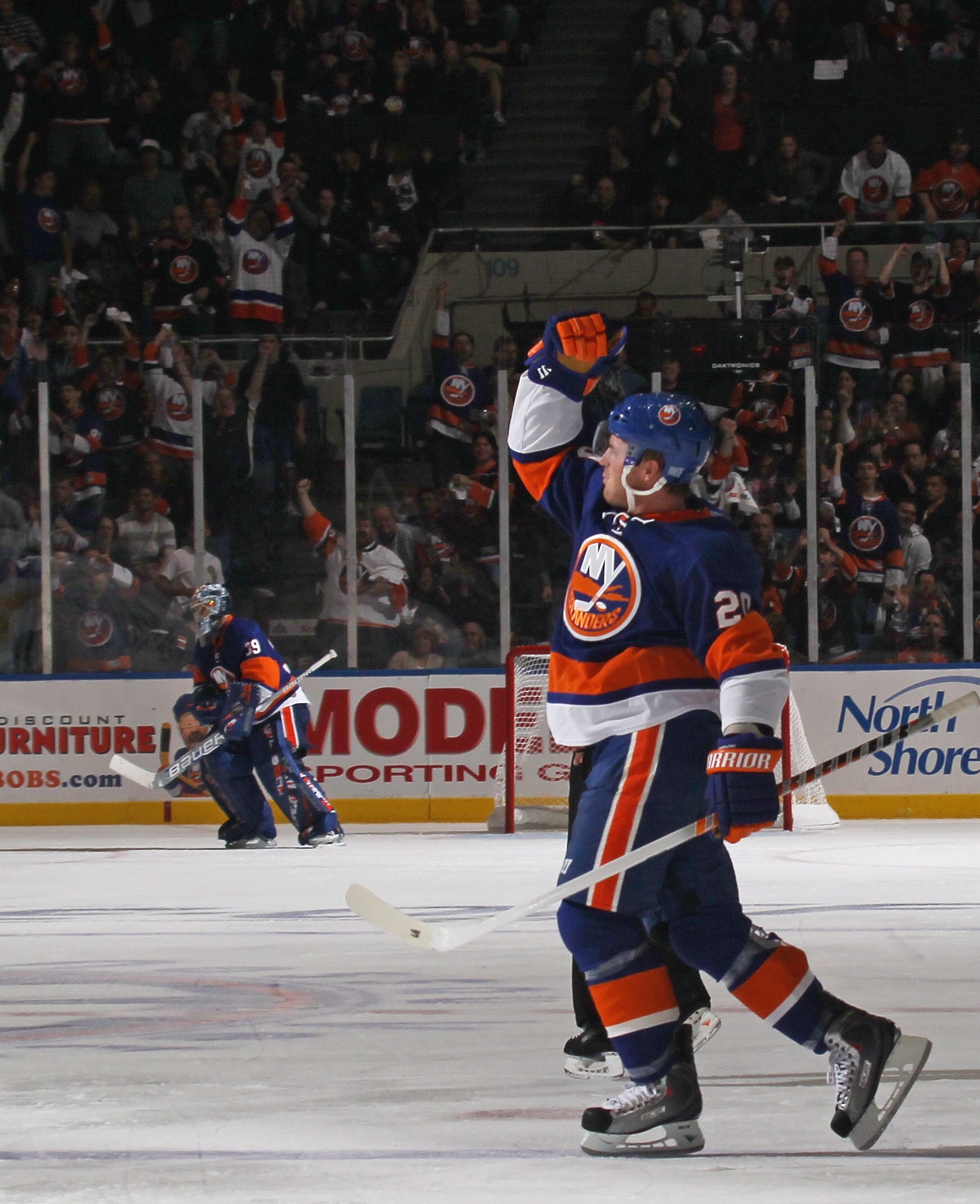 UNIONDALE, NY - OCTOBER 09:  James Wisniewski #20 of the New York Islanders scores a power play goal at 6:21 of the seocnd period against the Dallas Stars at the Nassau Coliseum on October 9, 2010 in Uniondale, New York.  (Photo by Bruce Bennett/Getty Ima