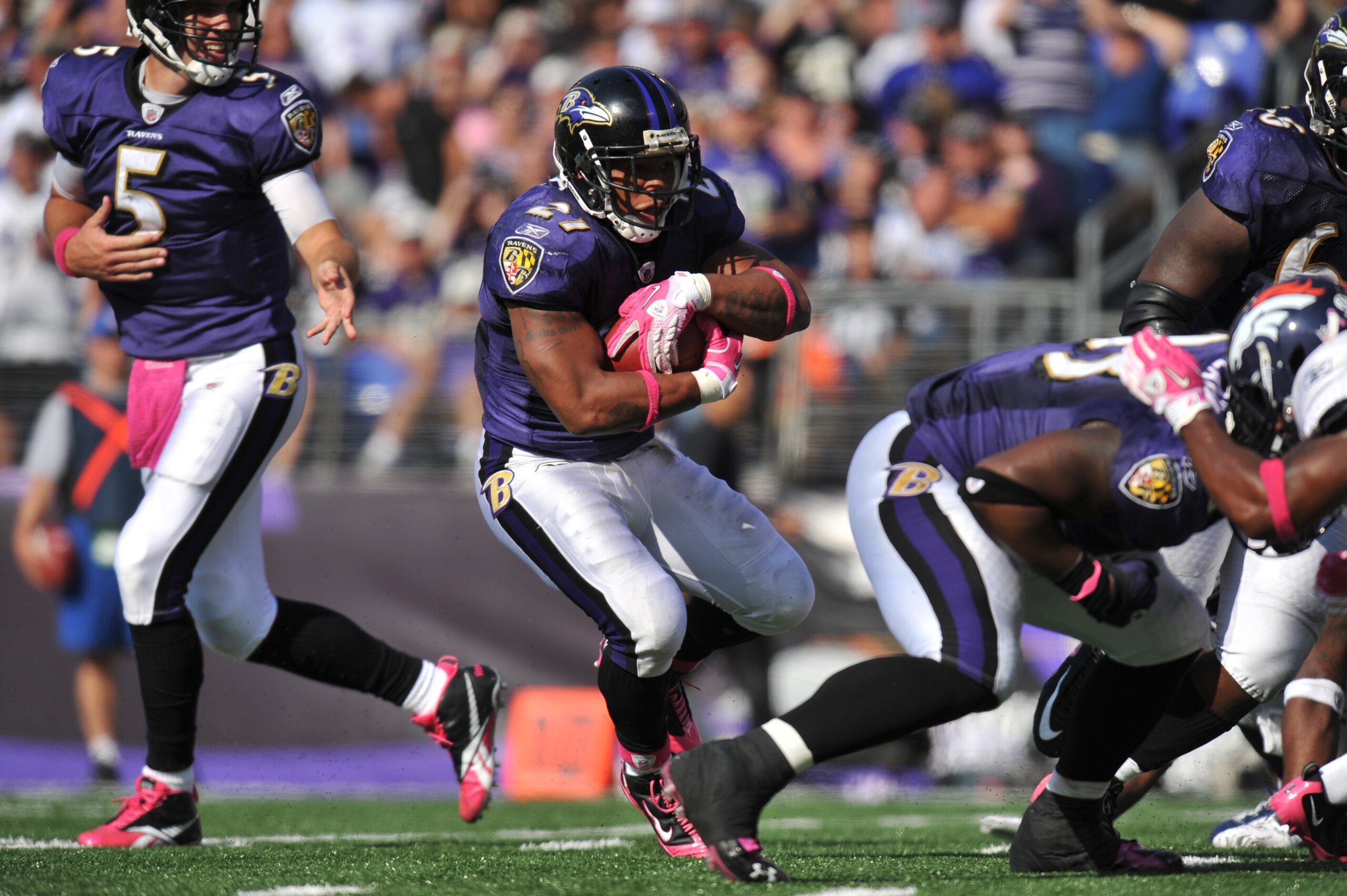 BALTIMORE, MD - OCTOBER 10: Ray Rice #27 of the Baltimore Ravens runs the ball against the Denver Broncos at M&T Bank Stadium on October 10, 2010 in Baltimore, Maryland. Players wore pink in recognition of Breast Cancer Awareness Month. The Ravens defeate
