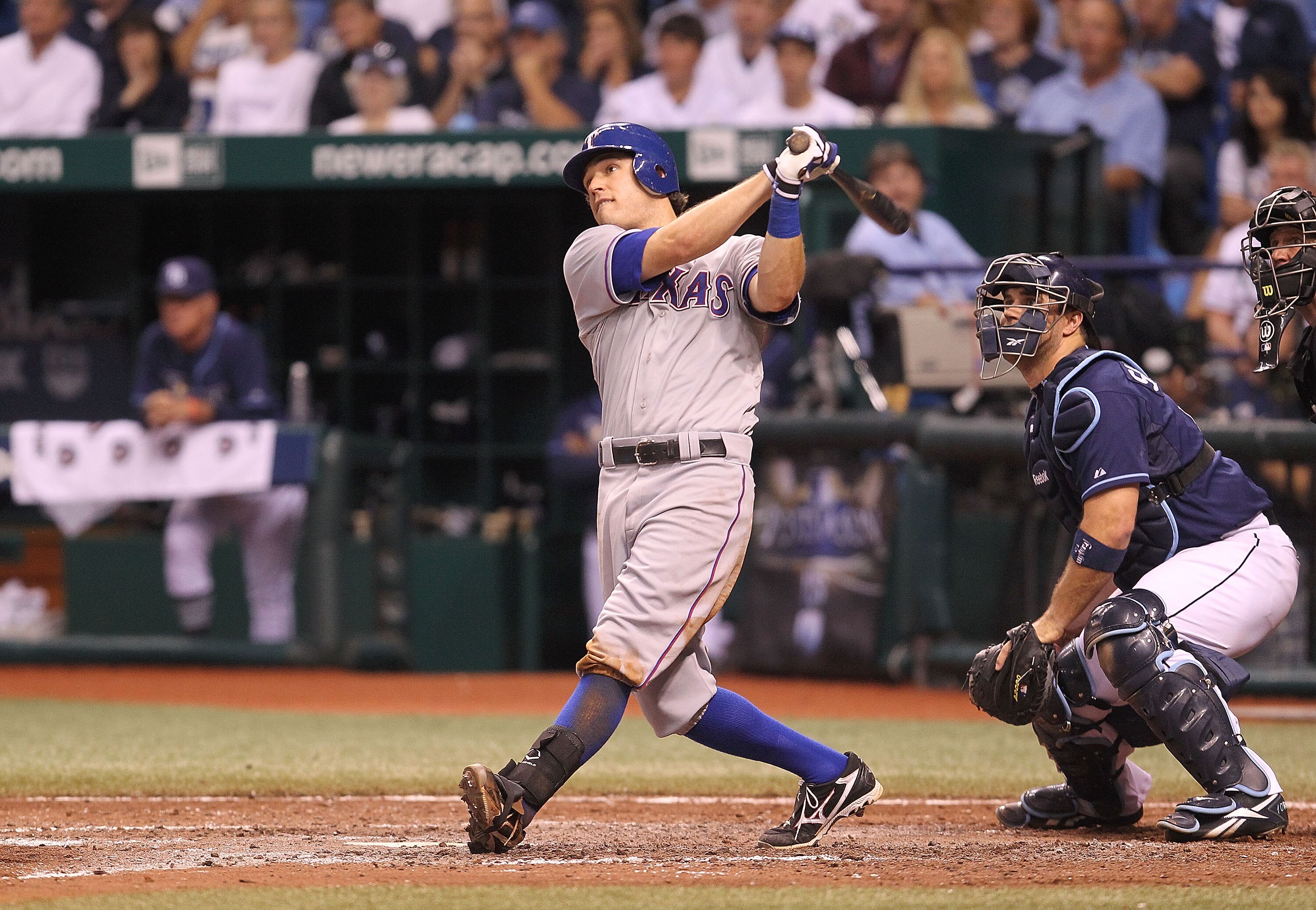 ST PETERSBURG, FL - OCTOBER 12:  Ian Kinsler #5 of the Texas Rangers hits a 2 run HR in the ninth inning off Joaquin Benoit #53 during Game 5 of the ALDS against the Tampa Bay Rays at Tropicana Field on October 12, 2010 in St. Petersburg, Florida.  (Photo