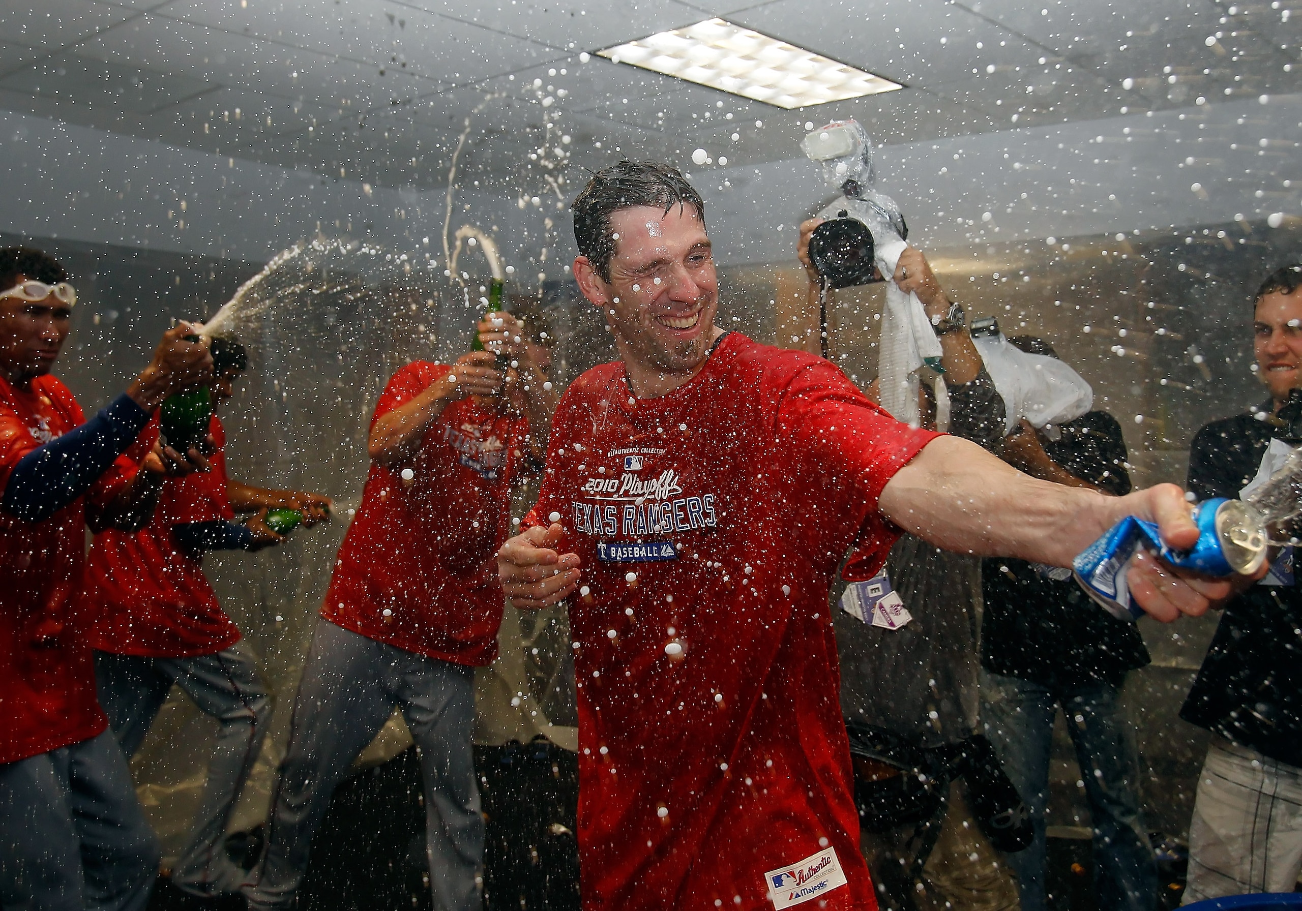 ST PETERSBURG, FL - OCTOBER 12:  :  Pitcher Cliff Lee #33 of the Texas Rangers celebrates his team's victory over the Tampa Bay Rays in Game 5 of the ALDS at Tropicana Field on October 12, 2010 in St. Petersburg, Florida.  (Photo by J. Meric/Getty Images)