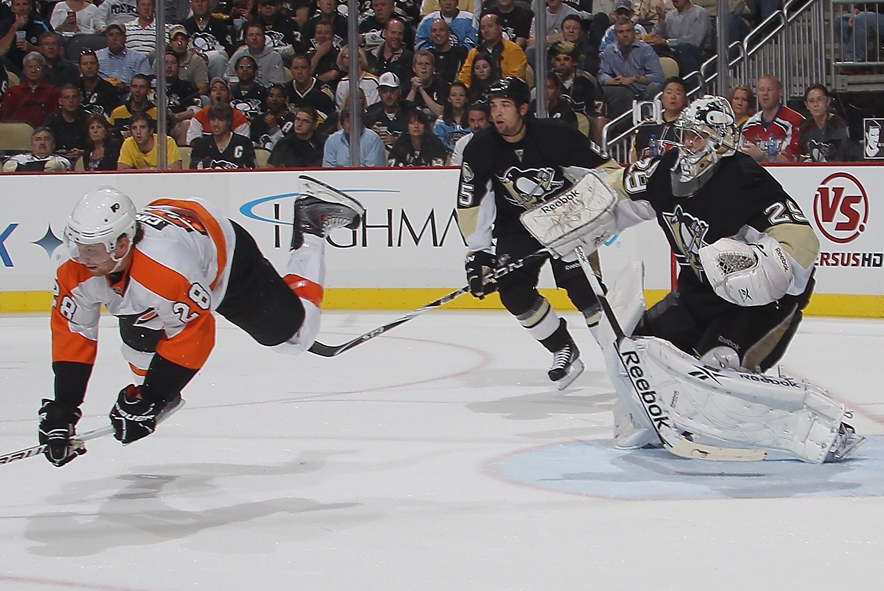 PITTSBURGH - OCTOBER 07: Marc-Andre Fleury #29 of the Pittsburgh Penguins trips up Claude Giroux #28 of the Philadelphia Flyers at the Consol Energy Center on October 7, 2010 in Pittsburgh, Pennsylvania.  (Photo by Bruce Bennett/Getty Images)