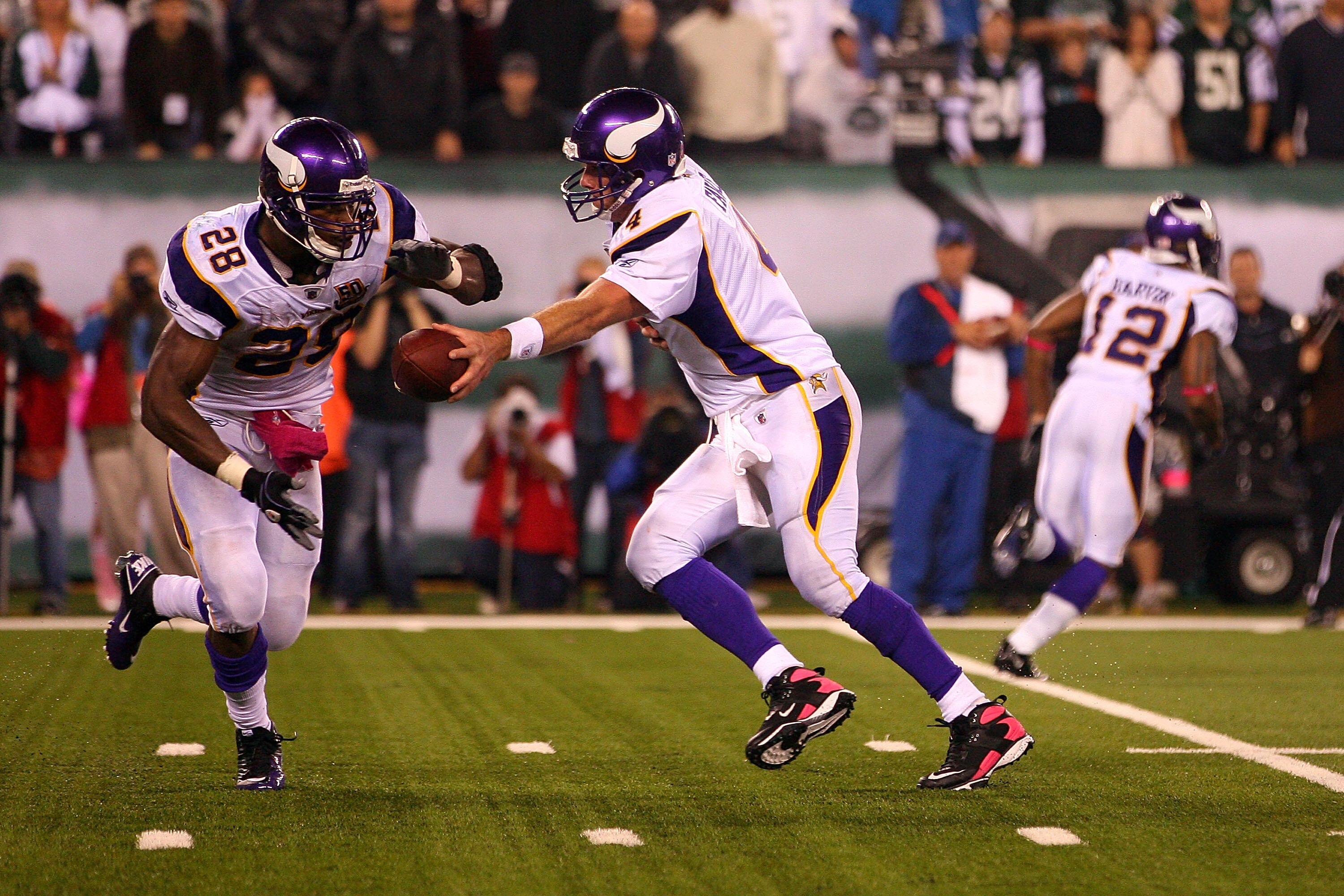 EAST RUTHERFORD, NJ - OCTOBER 11: Quarterback Brett Favre #4 of the Minnesota Vikings turns to hand the ball off to Adrian Peterson #28 against the New York Jets at New Meadowlands Stadium on October 11, 2010 in East Rutherford, New Jersey. (Photo by An EAST RUTHERFORD, NJ - OCTOBER 11: Quarterback Brett Favre #4 of the Minnesota Vikings turns to hand the ball off to Adrian Peterson #28 against the New York Jets at New Meadowlands Stadium on October 11, 2010 in East Rutherford, New Jersey. (Photo by An