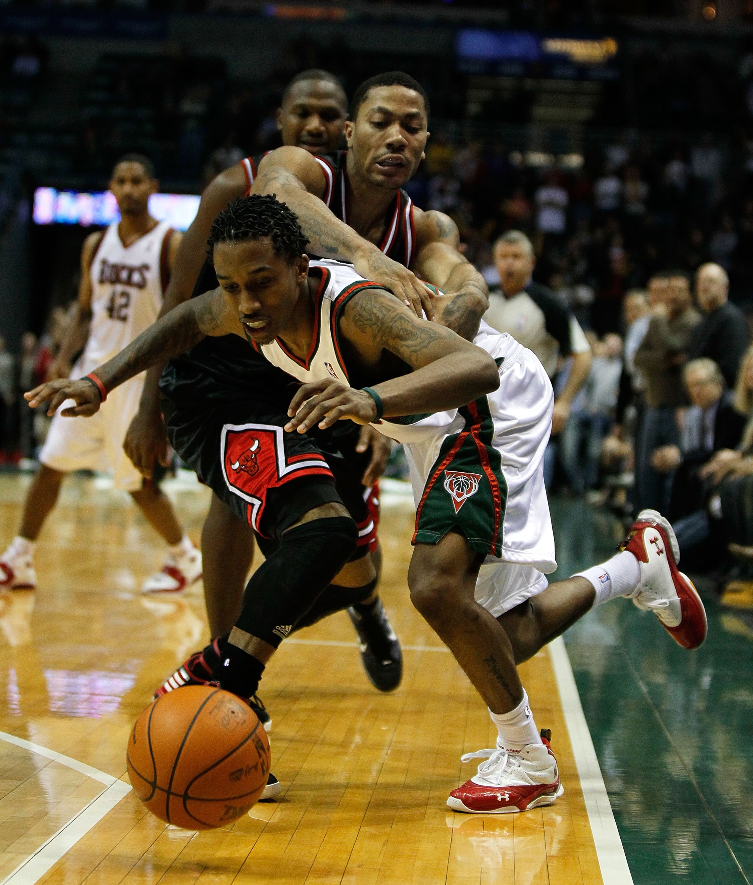 MILWAUKEE - NOVEMBER 30: Brandon Jennings #3 of the Milwuakee Bucks gets fouled in the closing minute by Derrick Rose #1 of the Chicago Bulls at the Bradley Center on November 30, 2009 in Milwaukee, Wisconsin. The Bucks defeated the Bulls 99-97. NOTE TO U