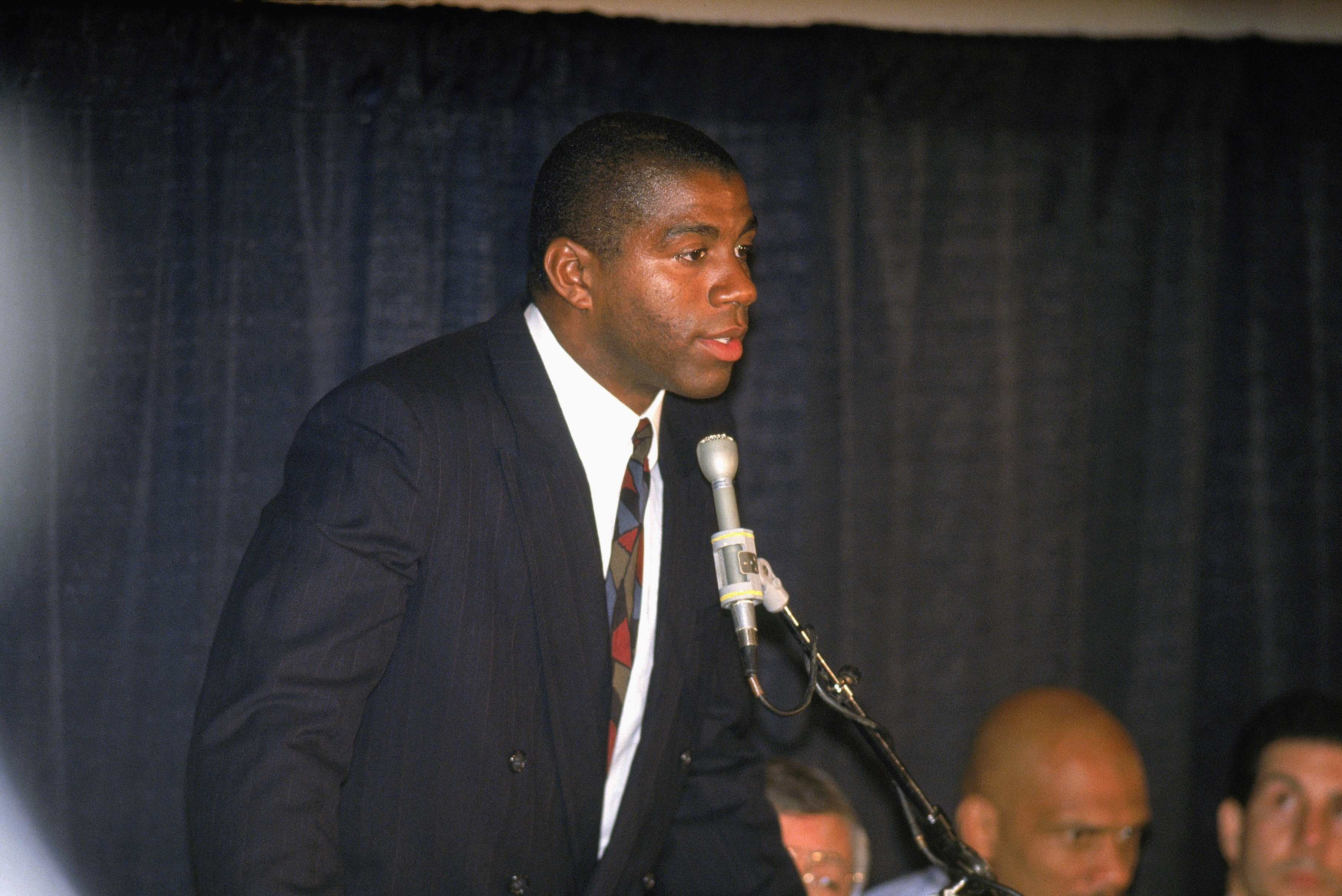 INGLEWOOD, CA - NOVEMBER 7:  Magic Johnson of the Los Angeles Lakers announces at a press conferences his retirement after being diagnosed as HIV positive. (Photo by Stephen Dunn/Getty Images)