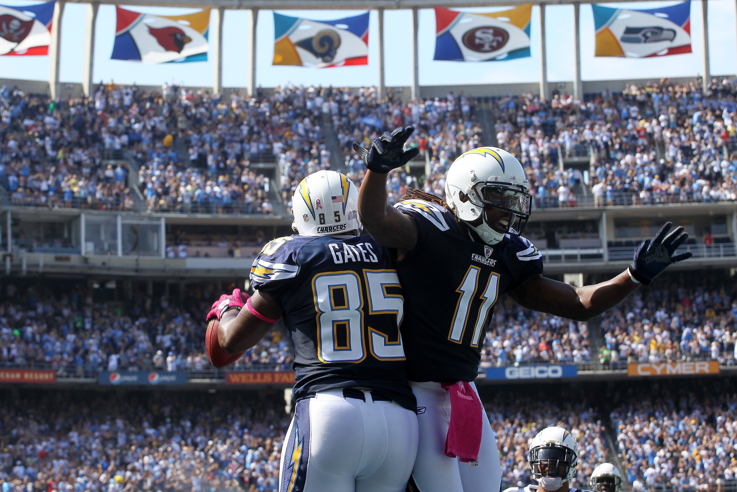 SAN DIEGO - OCTOBER 03:  Tight end Antonio Gates #85 and wide receiver Legedu Naanee #11 of the San Diego Chargers celebrate after a Gates touchdown reception against the Arizona Cardinals at Qualcomm Stadium on October 3, 2010 in San Diego, California.  