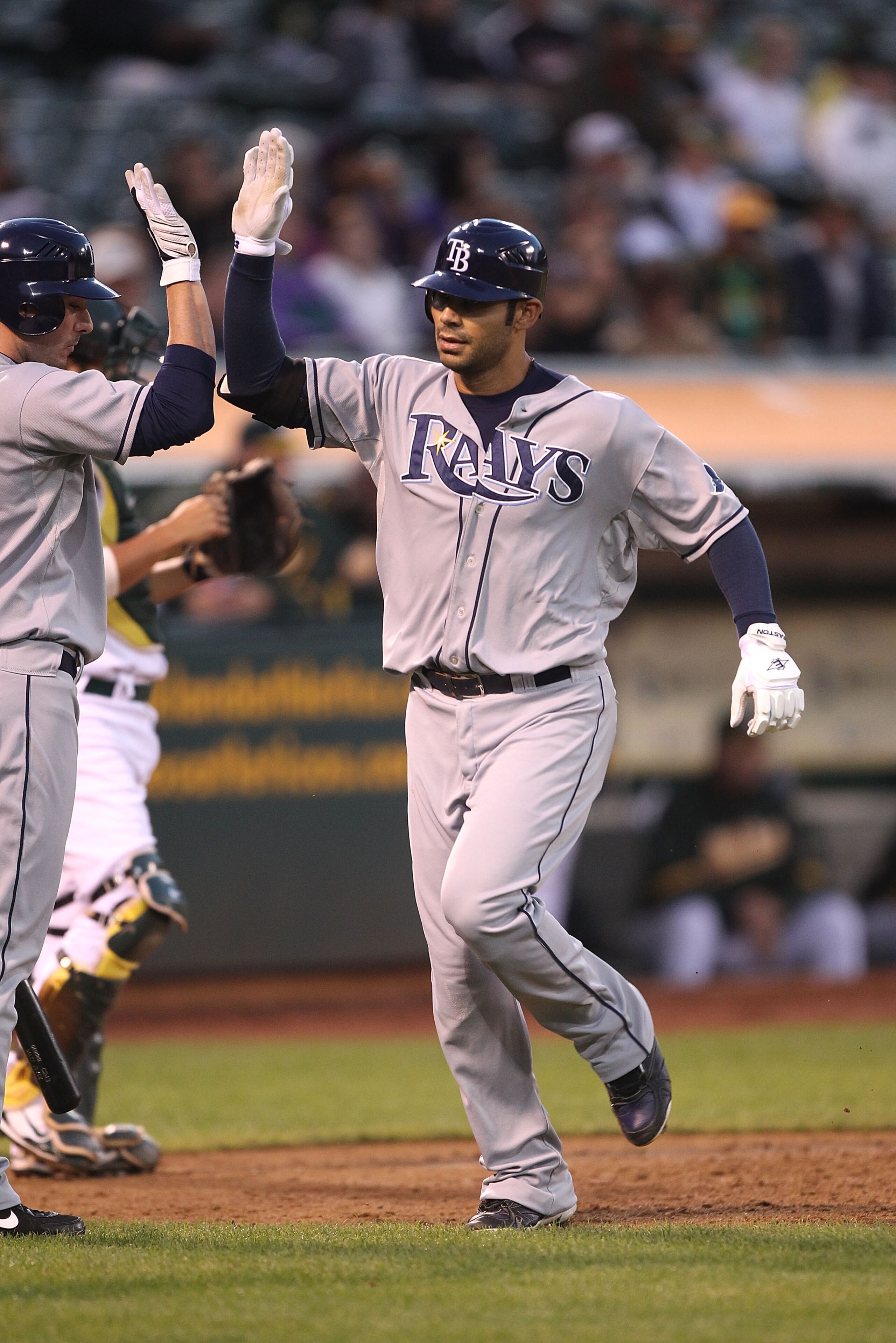 OAKLAND, CA - AUGUST 19:  Carlos Pena #23 of the Tampa Bay Rays celebrates after hitting a two run home run against the Oakland Athletics in the fourth inning during an MLB game at the Oakland-Alameda County Coliseum on August 19, 2010 in Oakland, Califor