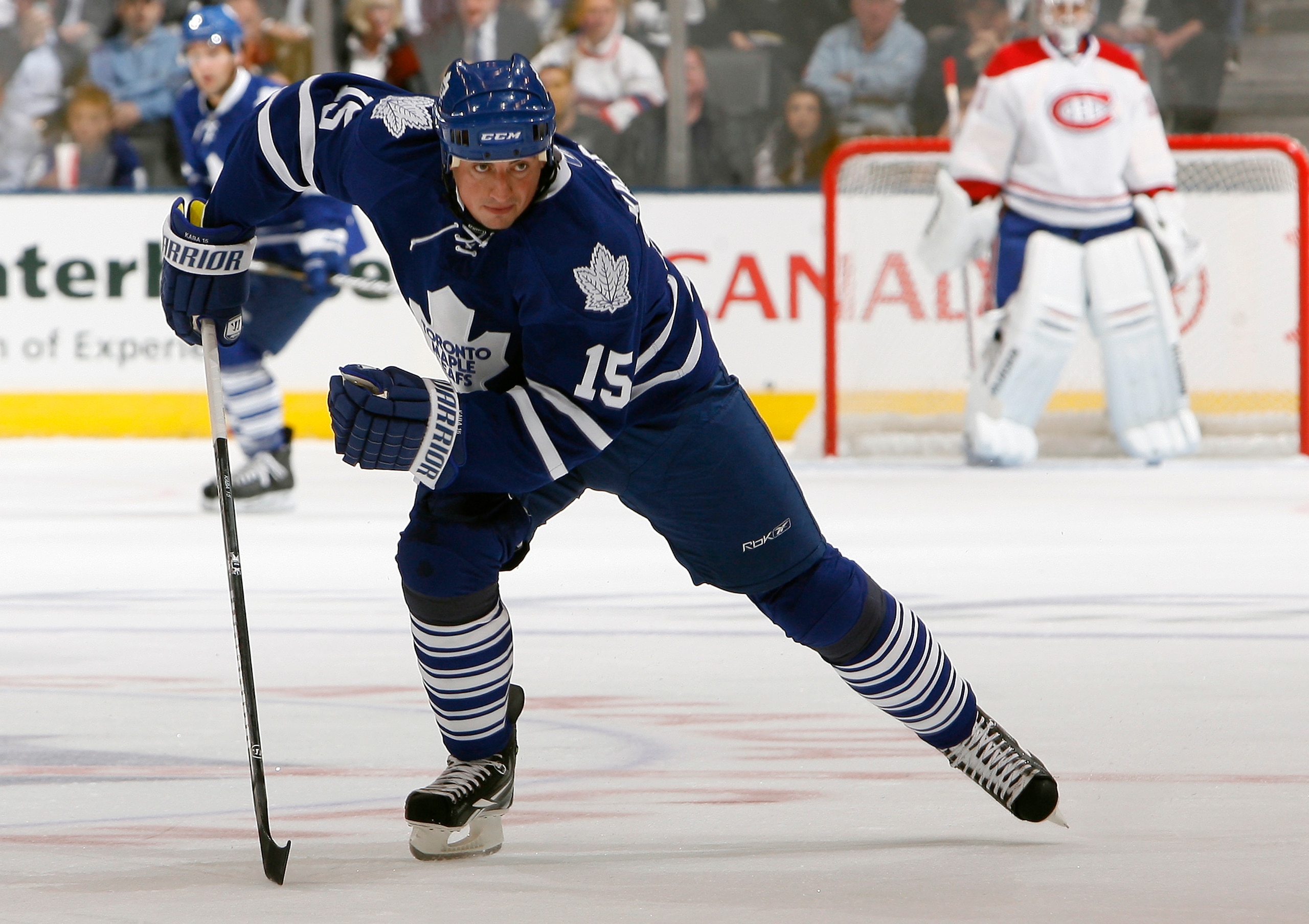 TORONTO, CANADA - OCTOBER 07: Tomas Kaberle #15 of the Toronto Maple Leafs skates up the ice during a regular season NHL game against the Montreal Canadiens at the Air Canada Centre October 7, 2010 in Toronto, Ontario, Canada. (Photo by Abelimages/Getty I