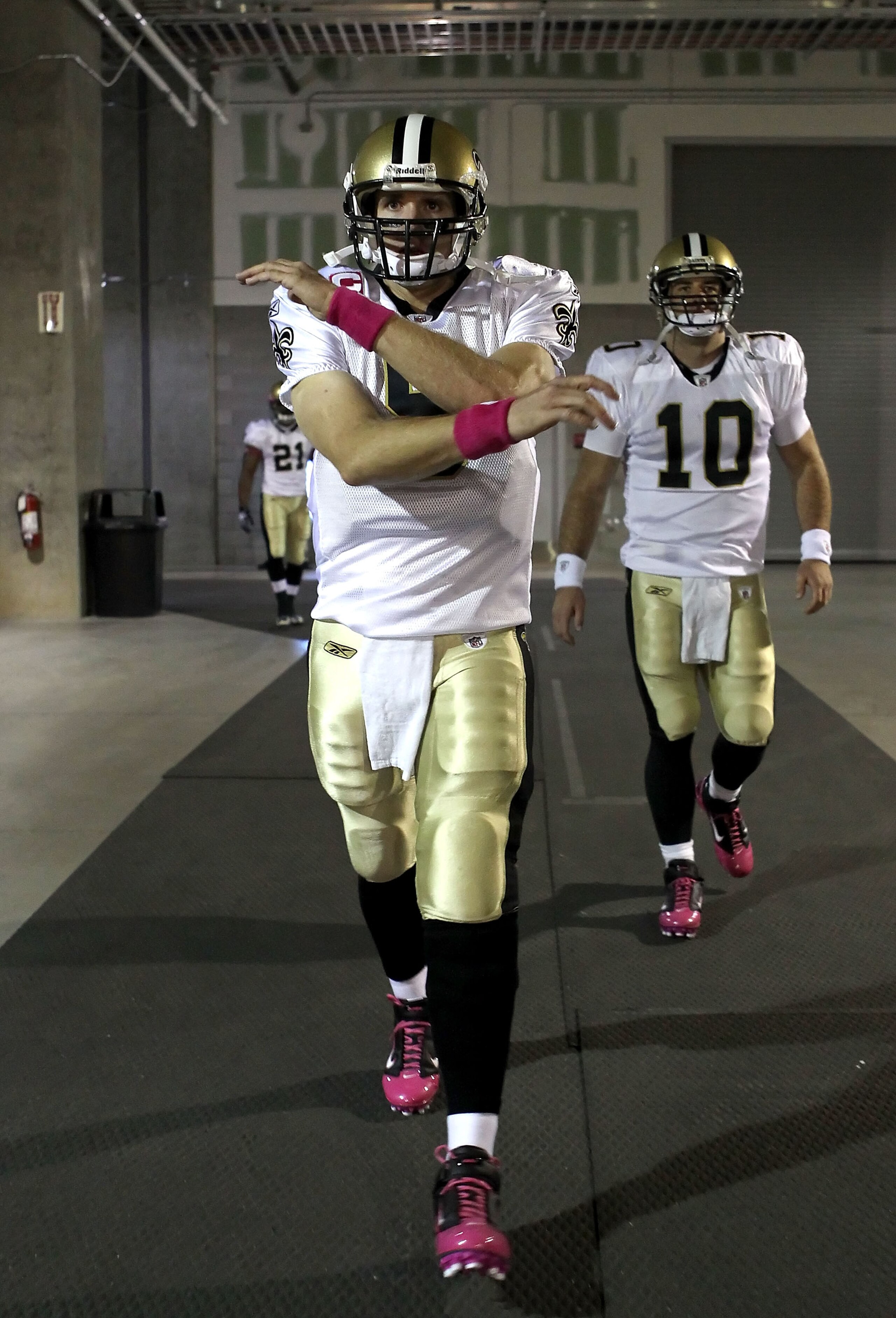 GLENDALE, AZ - OCTOBER 10:  Quarterback Drew Brees #9 of the New Orleans Saints leads teammates out of the locker room before the NFL game against the Arizona Cardinals at the University of Phoenix Stadium on October 10, 2010 in Glendale, Arizona. The Car