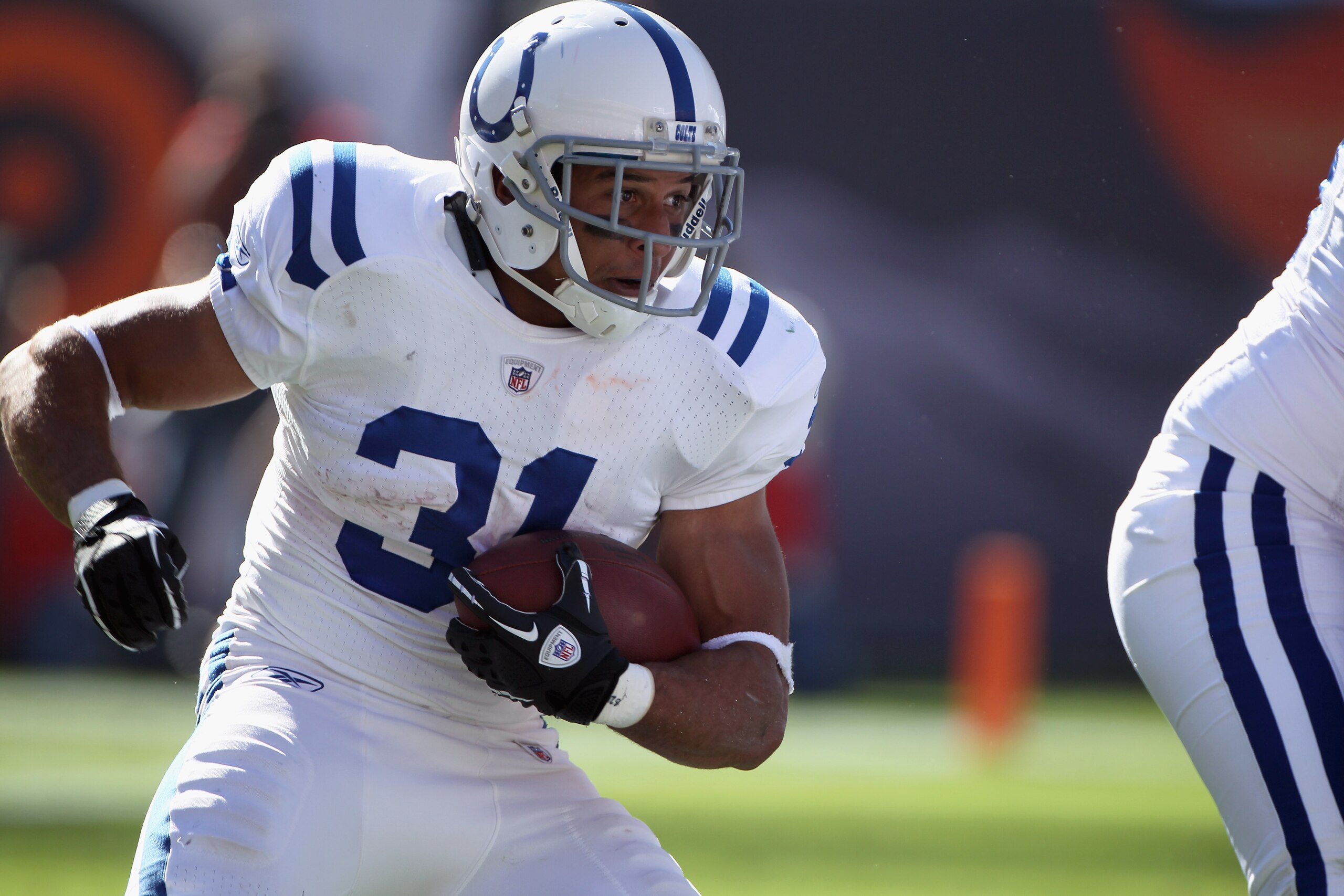 DENVER - SEPTEMBER 26:  Running back Donald Brown #31 of the Indianapolis Colts carries the ball against the Denver Broncos at INVESCO Field at Mile High on September 26, 2010 in Denver, Colorado. The Colts defeated the Broncos 27-13.  (Photo by Doug Pens