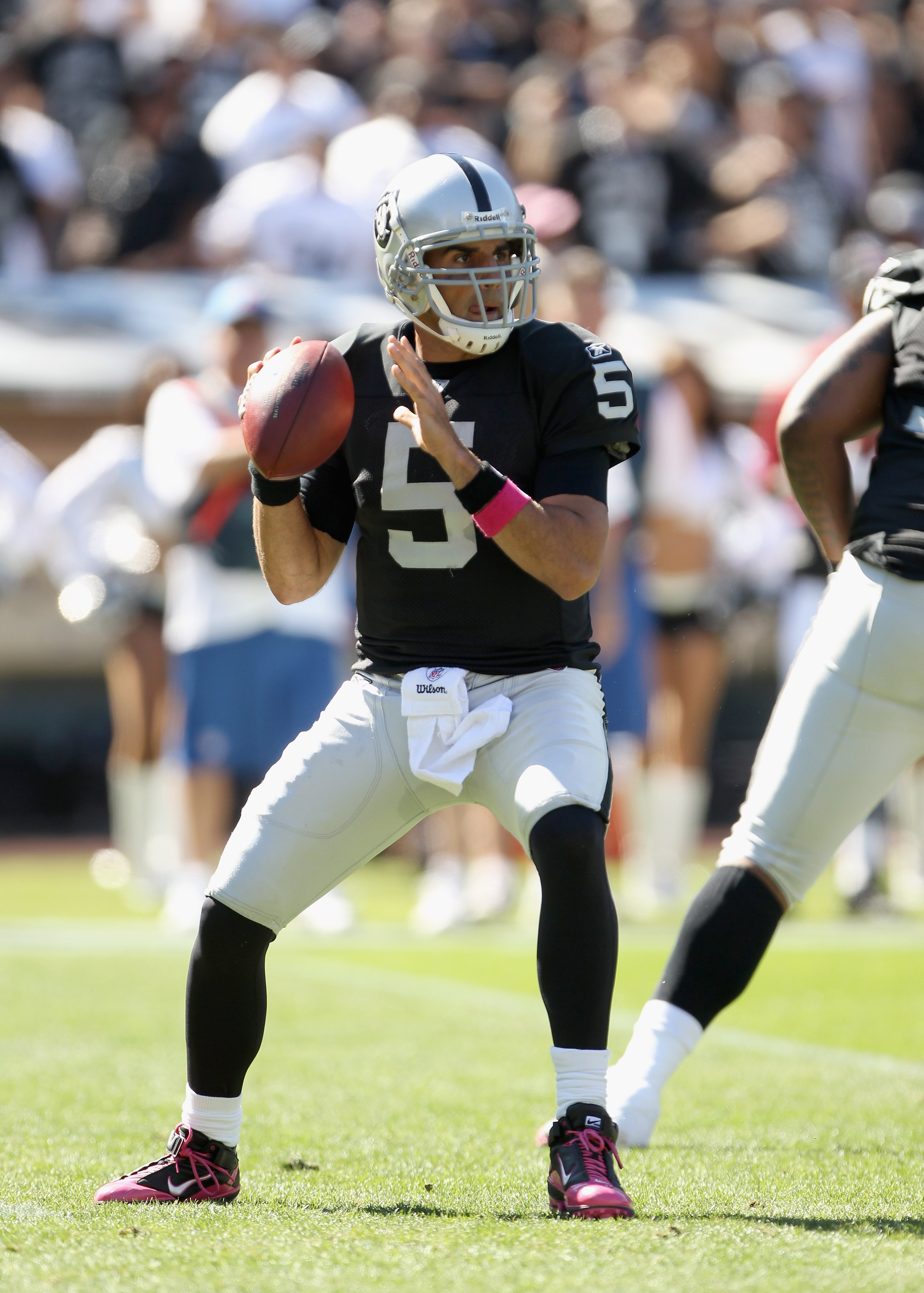 OAKLAND, CA - OCTOBER 10:  Bruce Gradkowski #5 of the Oakland Raiders passes the ball against the San Diego Chargers at Oakland-Alameda County Coliseum on October 10, 2010 in Oakland, California.  (Photo by Ezra Shaw/Getty Images)