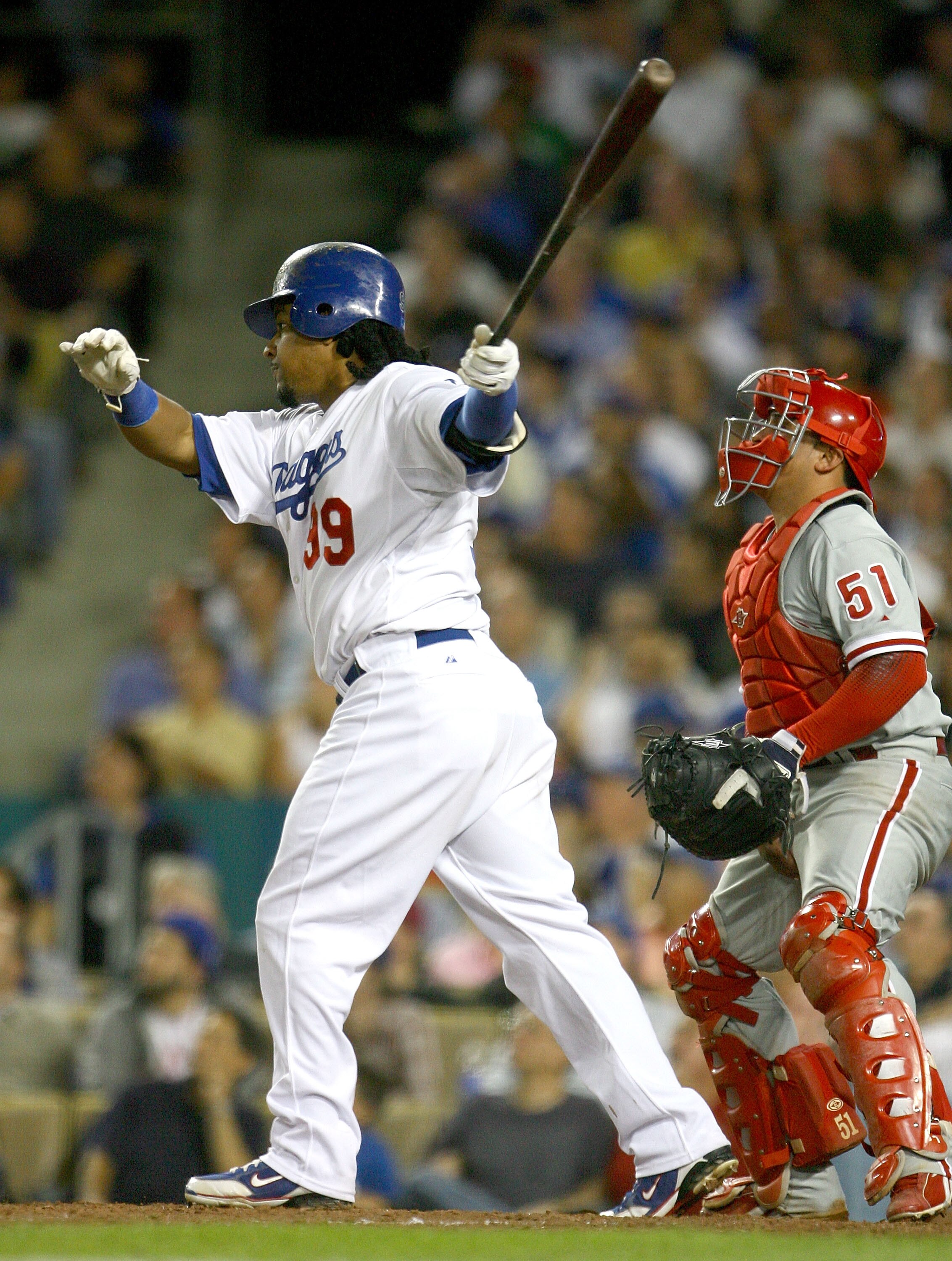 LOS ANGELES, CA - OCTOBER 15:  Manny Ramirez #99 of the Los Angeles Dodgers swings and hits a solo home run in the sixth inning against the Philadelphia Phillies in Game Five of the National League Championship Series during the 2008 MLB playoffs on Octob