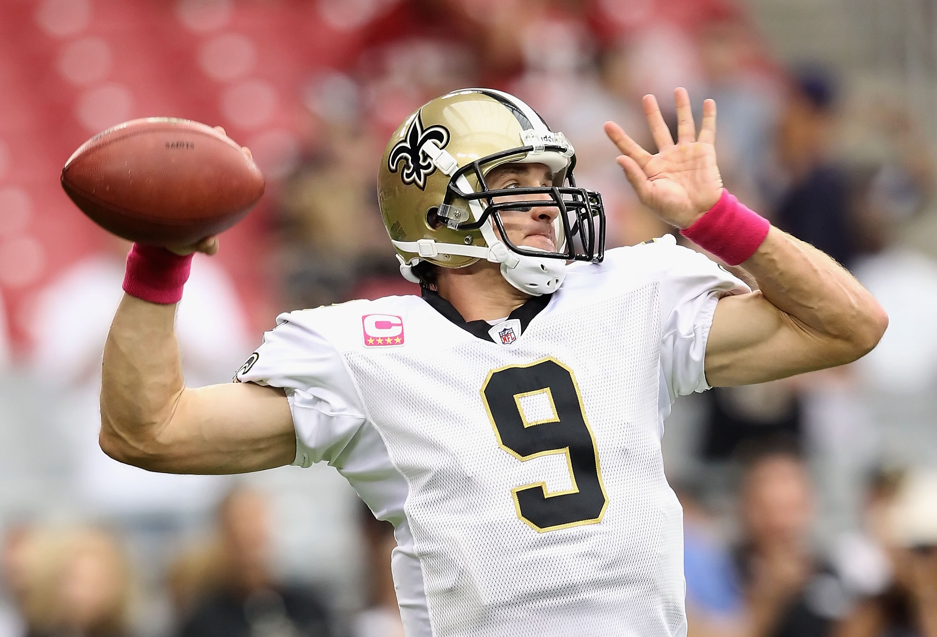GLENDALE, AZ - OCTOBER 10:  Quarterback Drew Brees #9 of the New Orleans Saints warms up before the NFL game against the Arizona Cardinals at the University of Phoenix Stadium on October 10, 2010 in Glendale, Arizona. The Cardinals defeated the Saints 30-