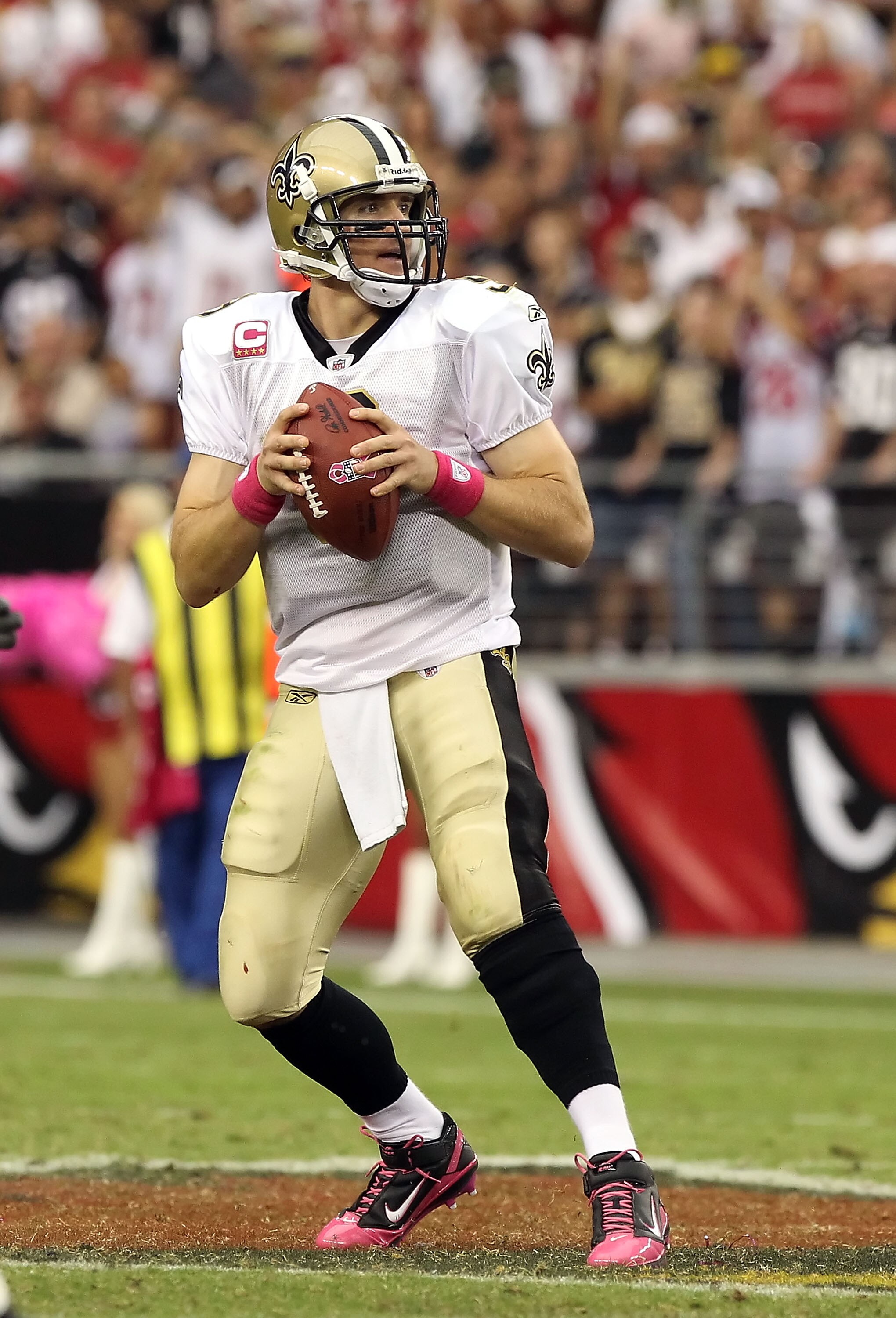 GLENDALE, AZ - OCTOBER 10:  Quarterback Drew Brees #9 of the New Orleans Saints drops back to pass during the NFL game against the Arizona Cardinals at the University of Phoenix Stadium on October 10, 2010 in Glendale, Arizona. The Cardinals defeated the 