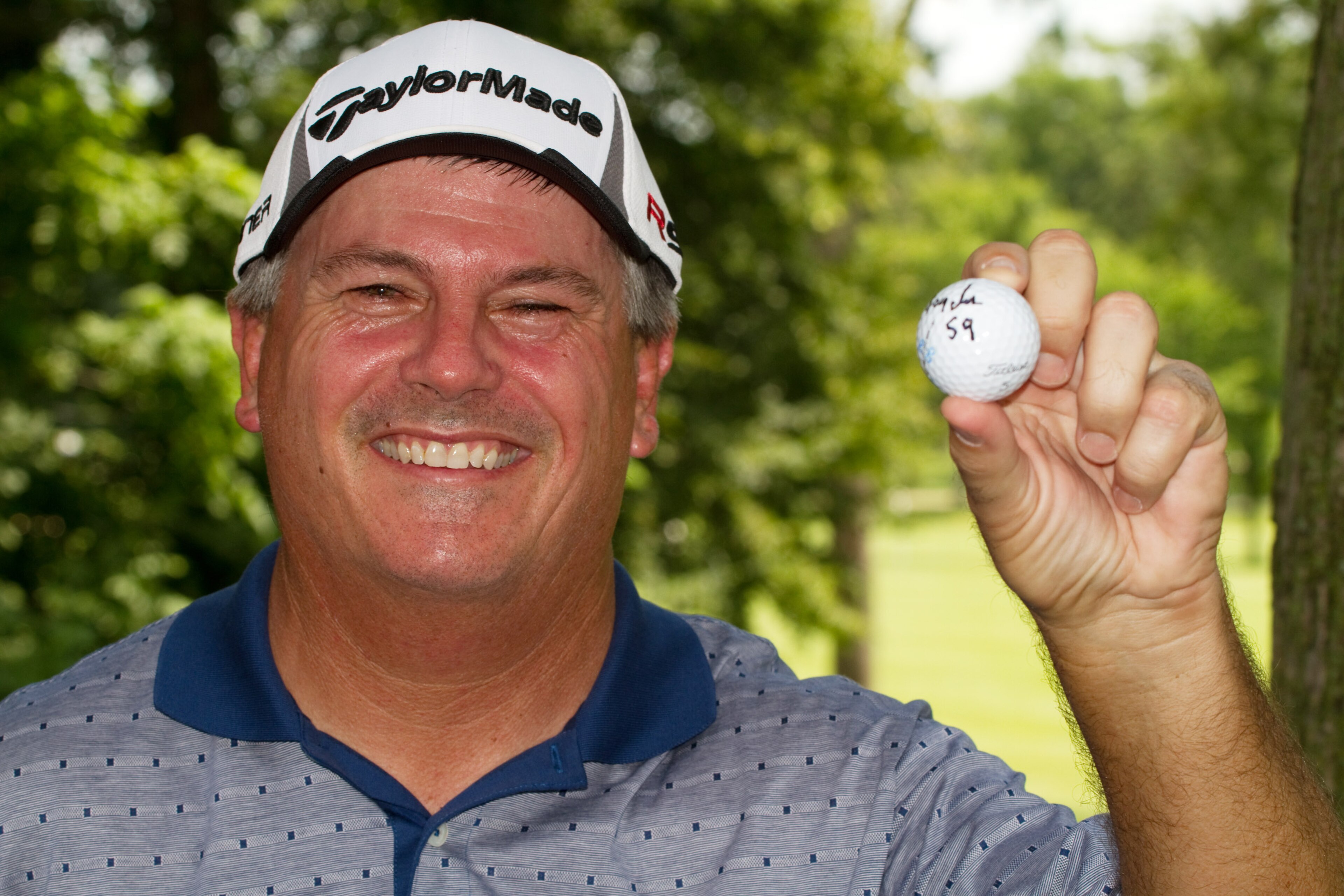 SILVIS, IL - JULY 8: Paul Goydos poses with the ball he used on the front nine to shoot a 59 in the first round of the John Deere Classic at TPC Deere Run on July 8, 2010 in Silvis, Illinois. (Photo by Darren Carroll/Getty Images)