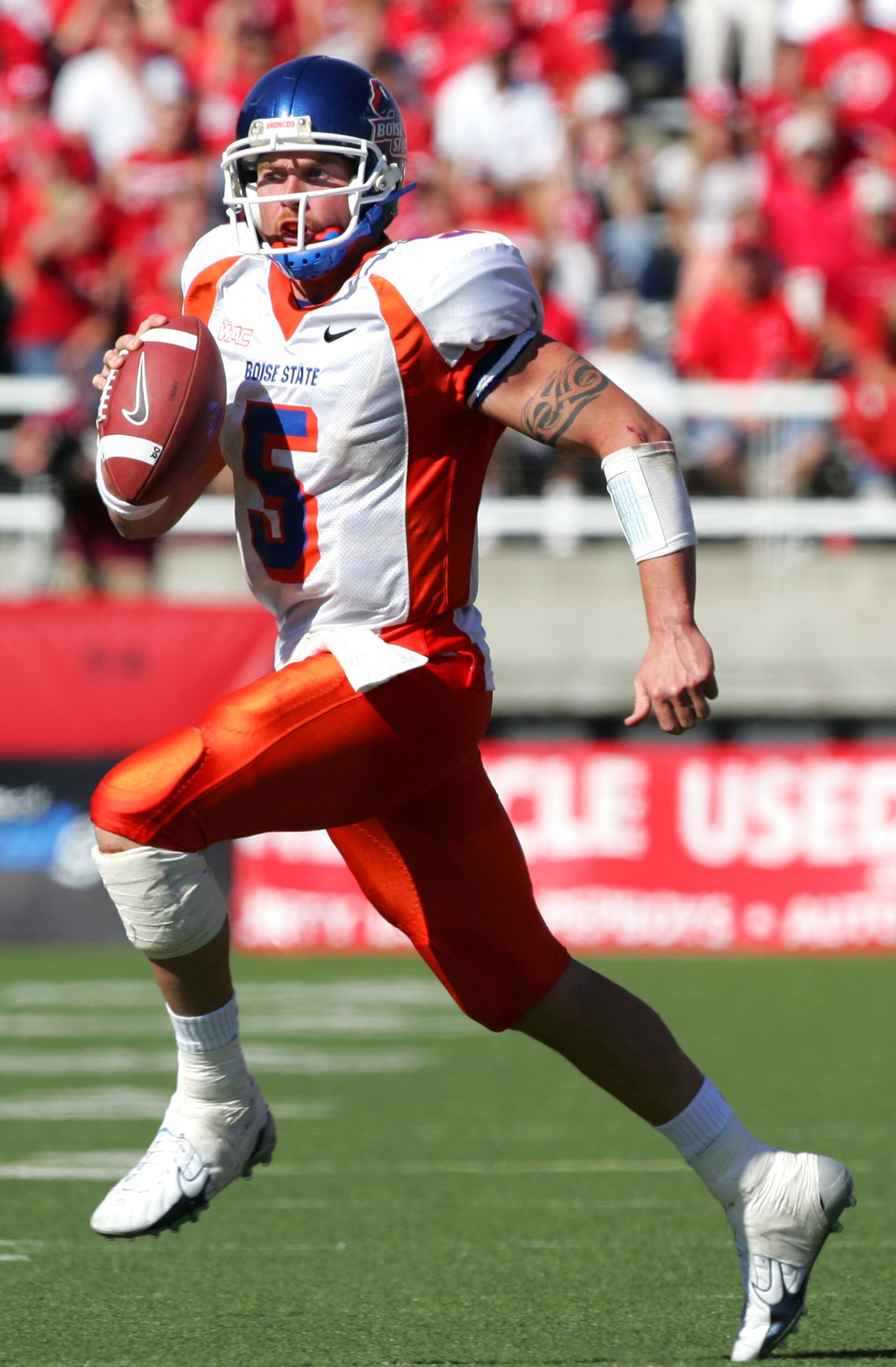 SALT LAKE CITY - SEPTEMBER 30:   Quarterback Jared Zabransky #5 of the Boise State Broncos looks to pass the ball as he runs against the Utah Utes at Rice-Eccles Stadium on September 30, 2006 in Salt Lake City, Utah. The Broncos of Boise State beat the Ut