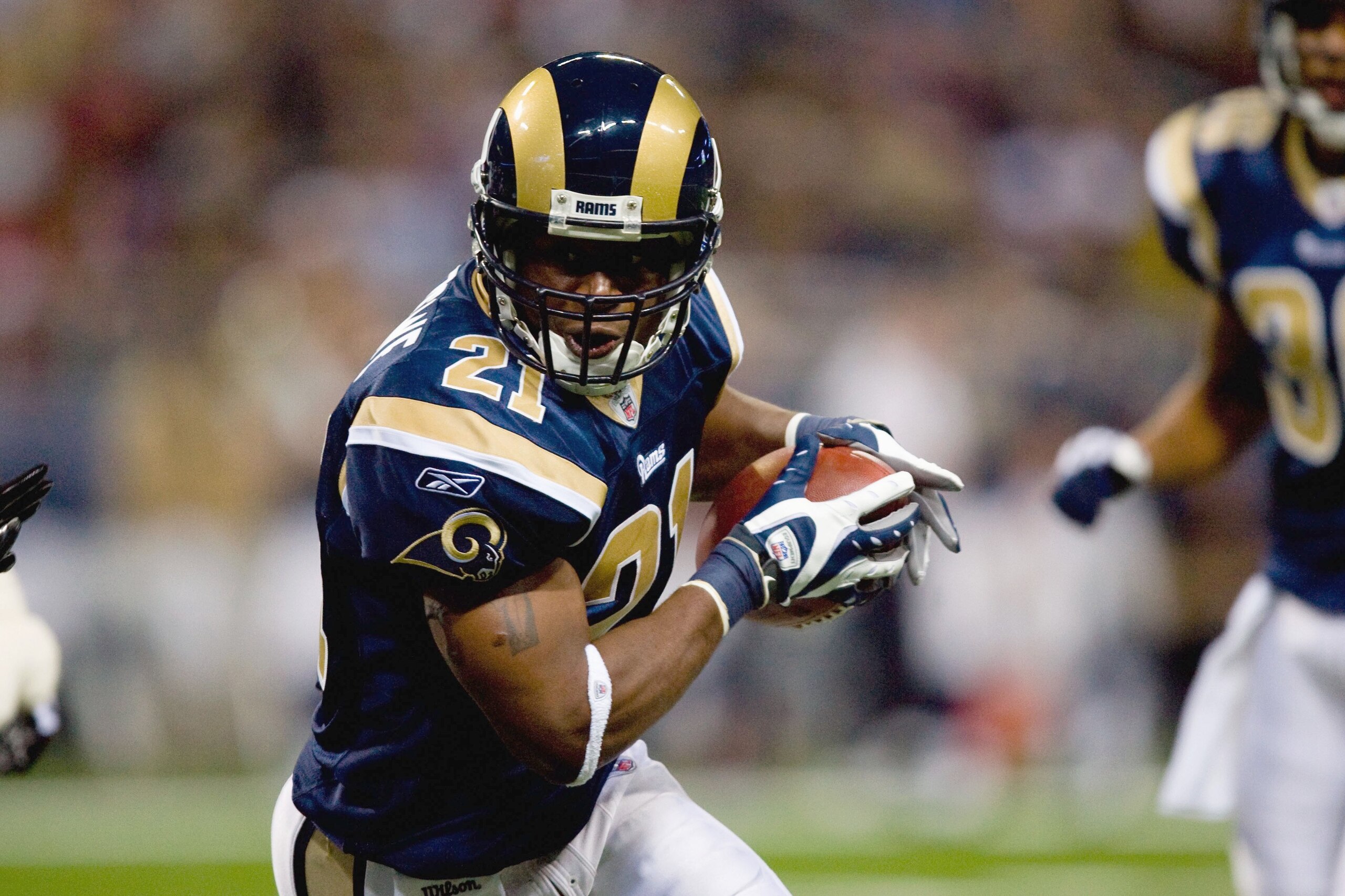 ST. LOUIS - NOVEMBER 22: Oshiomogho Atogwe #21 of the St. Louis Rams carries the ball against the Arizona Cardinals at the Edward Jones Dome on November 22, 2009 in St. Louis, Missouri. The Cardinals beat the Rams 21-13. (Photo by Dilip Vishwanat/Getty Im