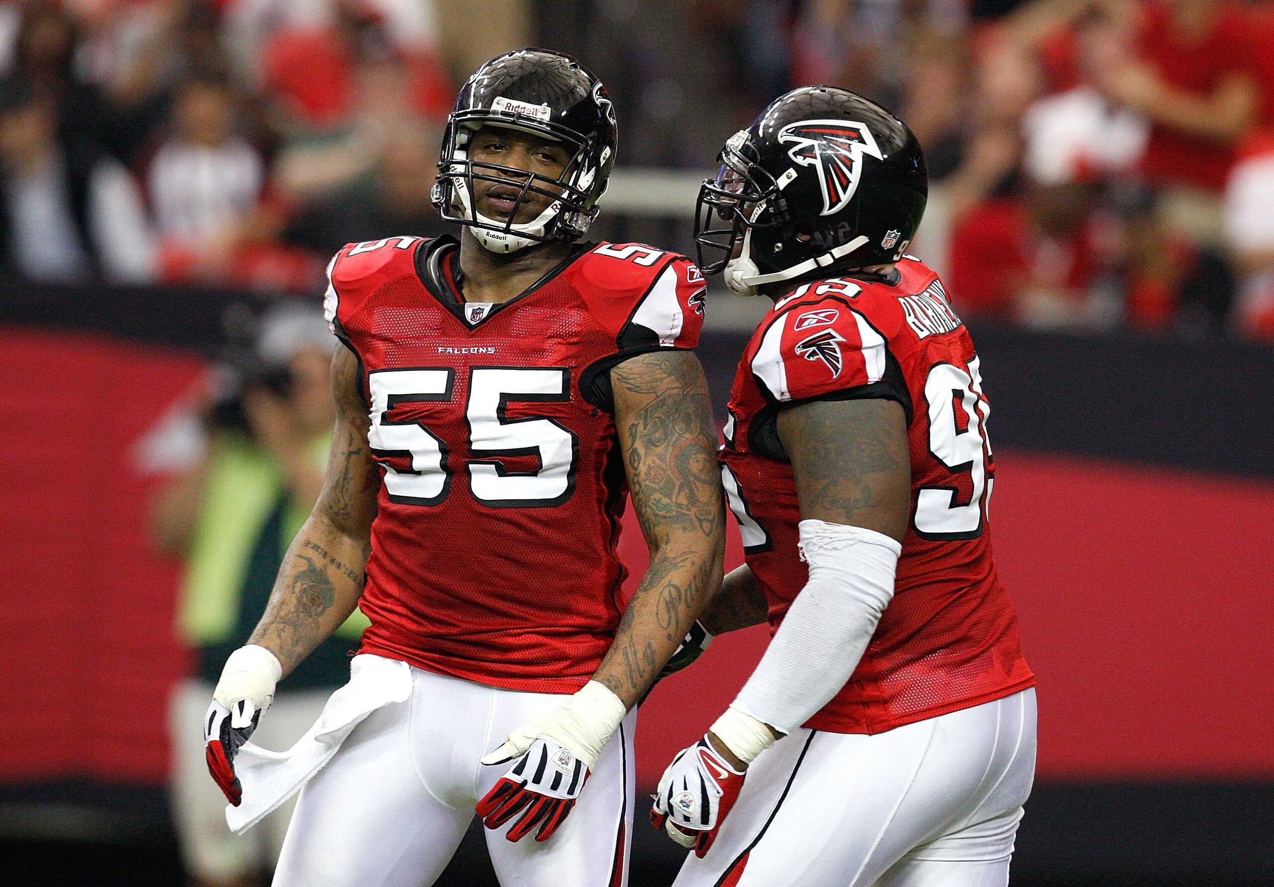 ATLANTA - NOVEMBER 08:  John Abraham #55 and Jonathan Babineaux #95 of the Atlanta Falcons against the Washington Redskins at Georgia Dome on November 8, 2009 in Atlanta, Georgia.  (Photo by Kevin C. Cox/Getty Images)
