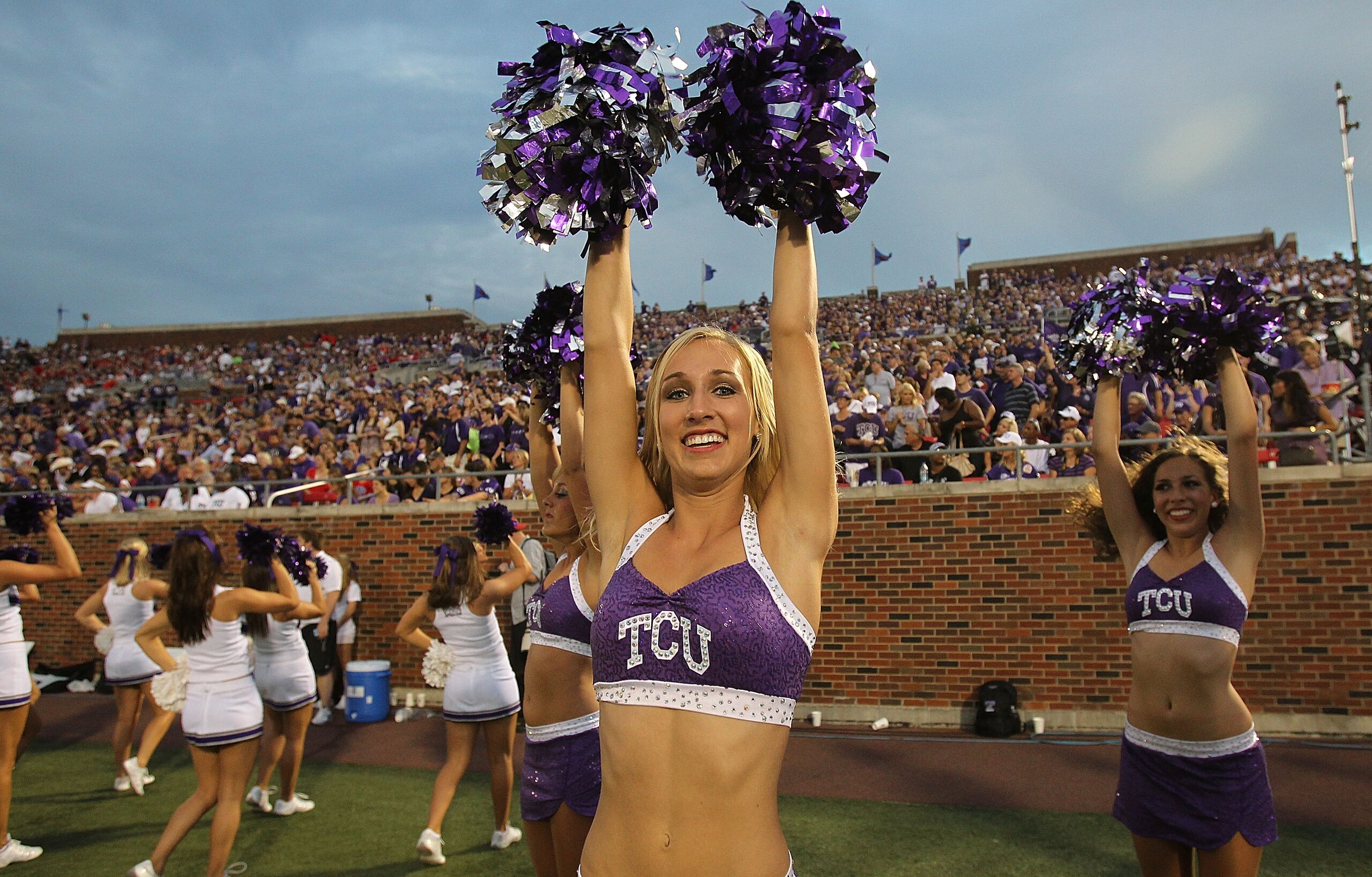 DALLAS - SEPTEMBER 24: A TCU Horned Frogs cheerleader performs at Gerald J. Ford Stadium on September 24, 2010 in Dallas, Texas.  (Photo by Ronald Martinez/Getty Images)