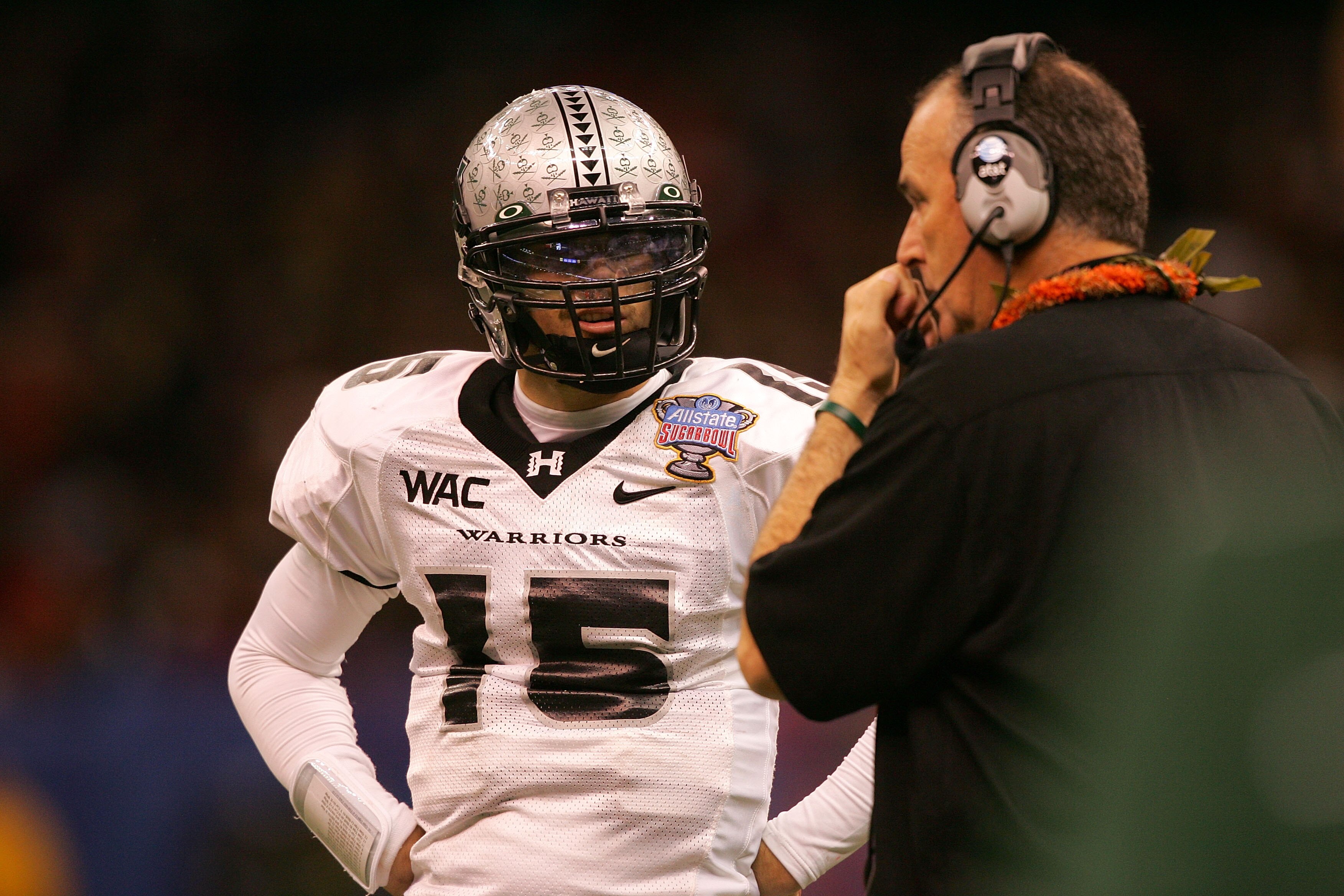 NEW ORLEANS - JANUARY 01:  Quarterback Colt Brennan #15 of the Hawai'i Warriors talks with head coach June Jones against the Georgia Bulldogs during the Allstate Sugar Bowl at the Louisiana Superdome on January 1, 2008 in New Orleans, Louisiana.  (Photo b