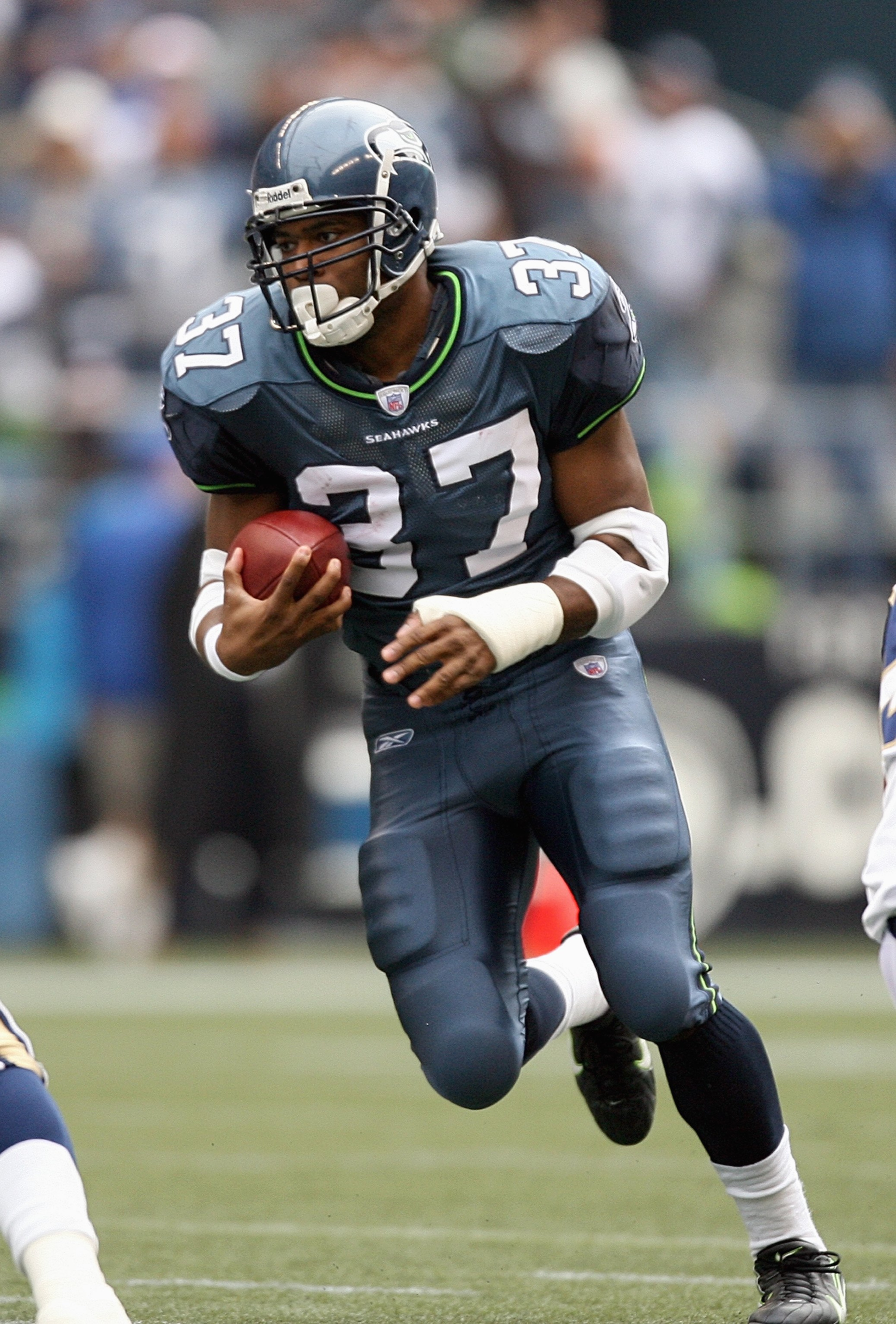 SEATTLE - OCTOBER 21: Shaun Alexander #37 of the Seattle Seahawks carries the ball during the game against the St. Louis Rams at Qwest Field on October 21, 2007 in Seattle, Washington. (Photo by Otto Greule Jr/Getty Images)