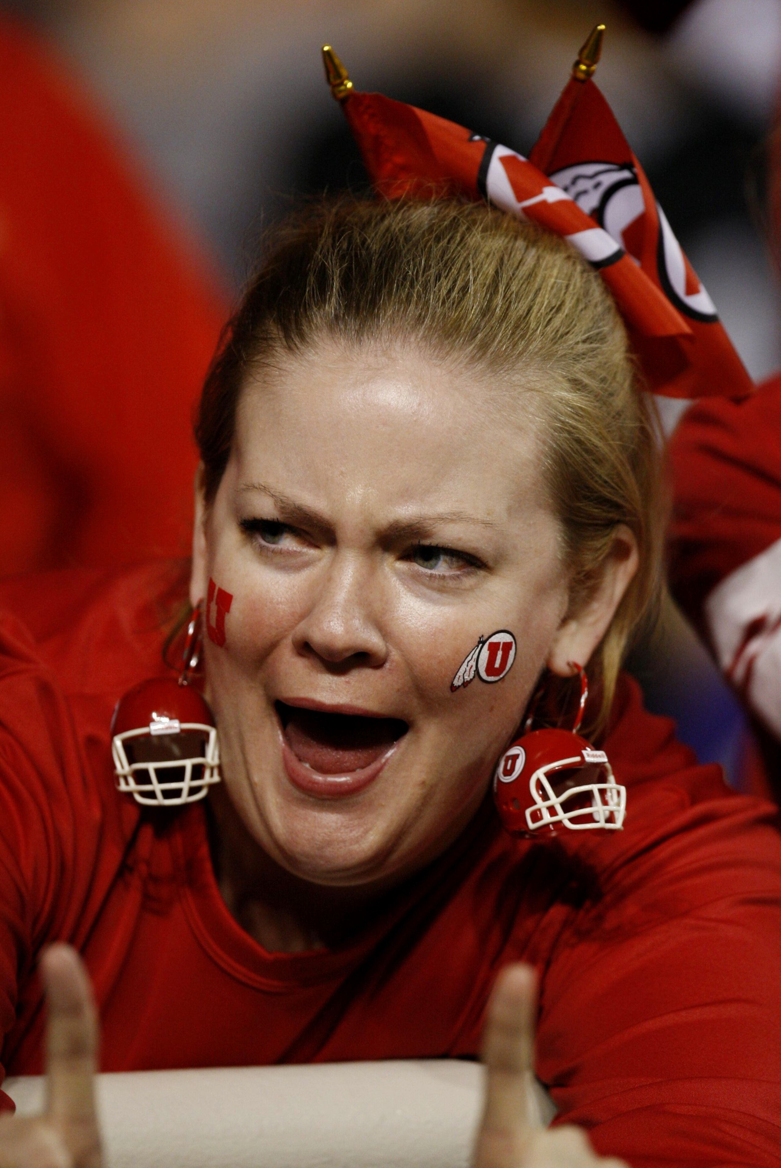FORT WORTH, TX - NOVEMBER 14:  A fan of the Utah Utes cheers for her team in the game against the TCU Horned Frogs at Amon G. Carter Stadium on November 14, 2009 in Fort Worth, Texas.  (Photo by Ronald Martinez/Getty Images)