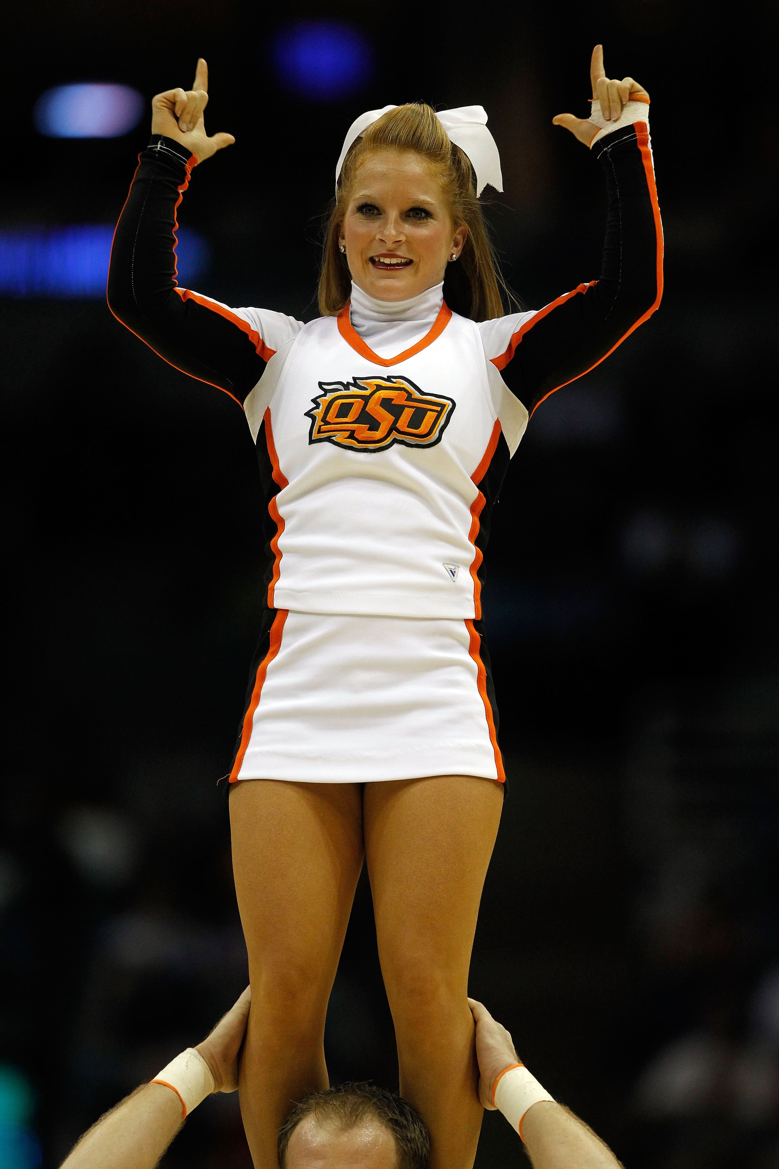 MILWAUKEE - MARCH 19:  An Oklahoma State Cowboys cheerleader performs in the second half against the Georgia Tech Yellow Jackets during the first round of the 2010 NCAA men's basketball tournament at the Bradley Center on March 19, 2010 in Milwaukee, Wisc
