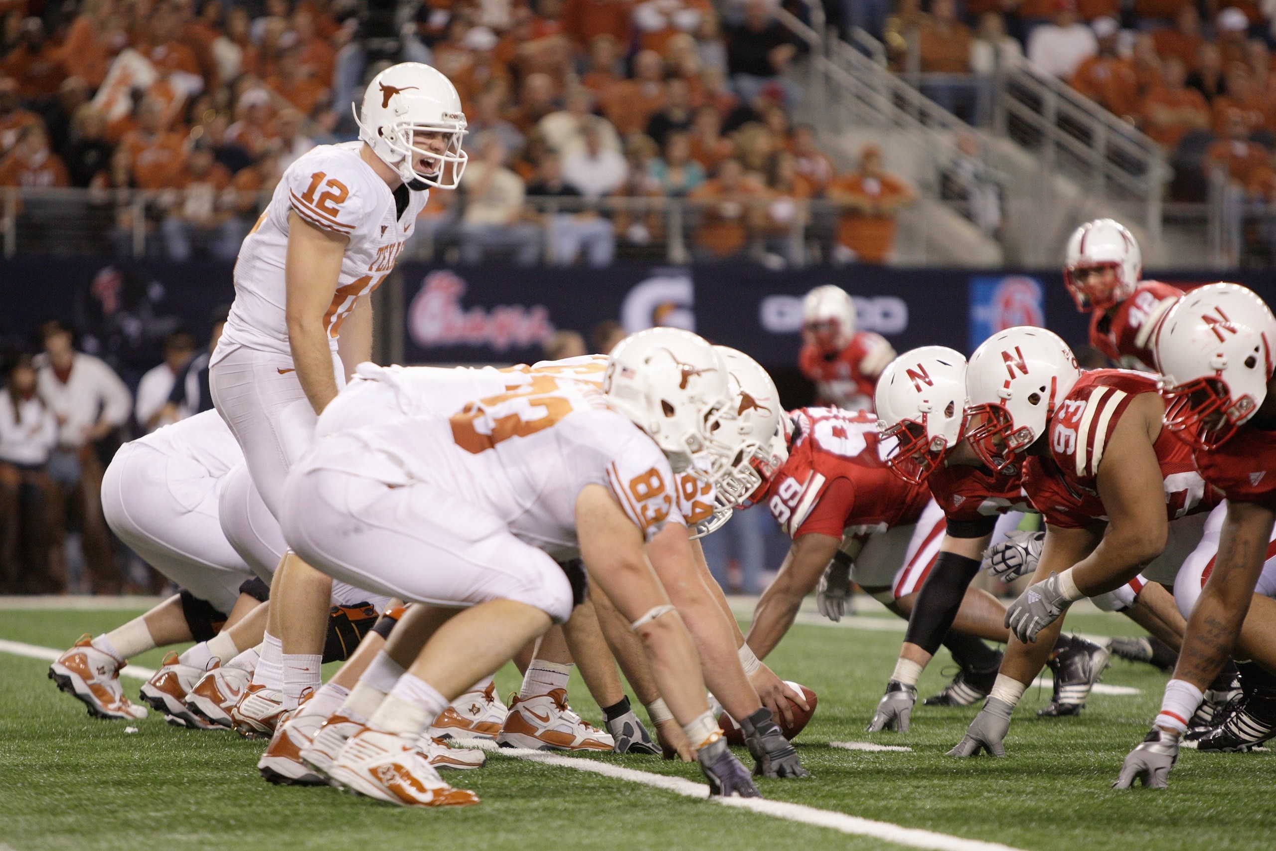 ARLINGTON, TX - DECEMBER 5: Colt McCoy #12 of the Texas Longhorns calls the play at the line of scrimmage during the Big 12 Football Championship game against the Nebraska Cornhuskers at Cowboys Stadium on December 5, 2009 in Arlington, Texas. (Photo by J