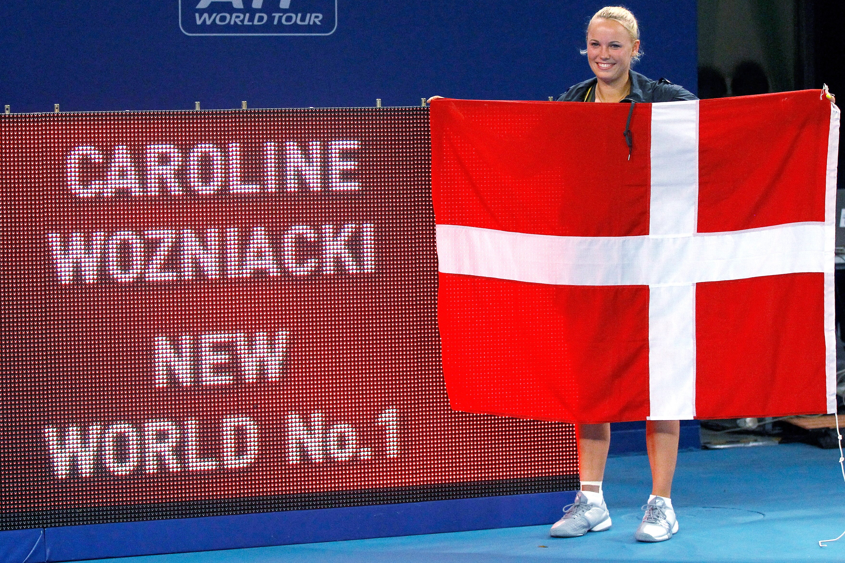 BEIJING - OCTOBER 07:  Caroline Wozniacki of Denmark poses for photographers after securing the world number 1 ranking on the WTA Tour after her win over Petra Kvitova the Czech Republic during day seven of the 2010 China Open at the National Tennis Cente