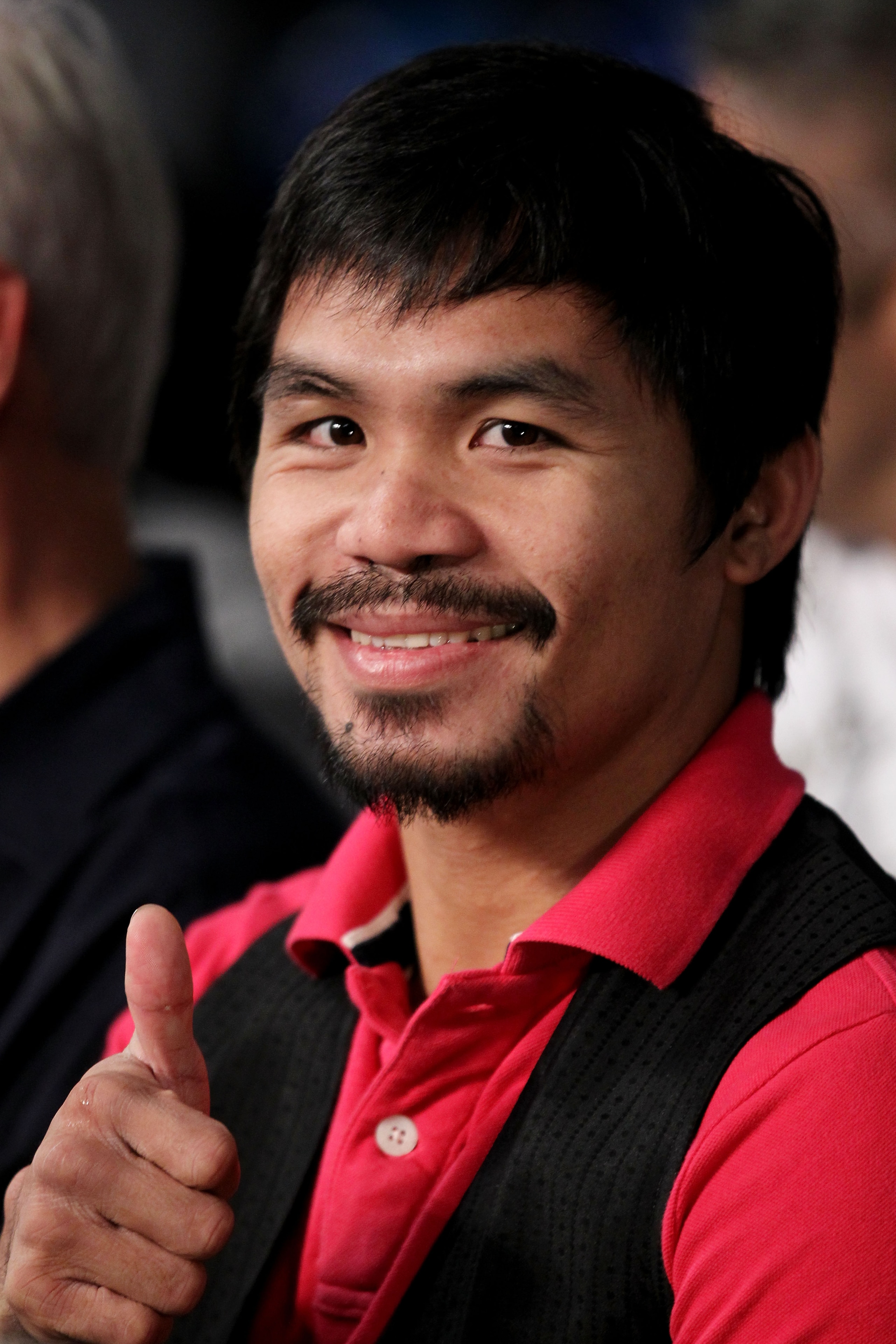 NEW YORK - JUNE 05: Professional boxer Manny Pacquiao watches the bout between Yuri Foreman and Miguel Cotto of Puerto Rico in the WBA world super welterweight title fight on June 5, 2010 at Yankee Stadium in the Bronx borough of New York City. Cotto win NEW YORK - JUNE 05: Professional boxer Manny Pacquiao watches the bout between Yuri Foreman and Miguel Cotto of Puerto Rico in the WBA world super welterweight title fight on June 5, 2010 at Yankee Stadium in the Bronx borough of New York City. Cotto win