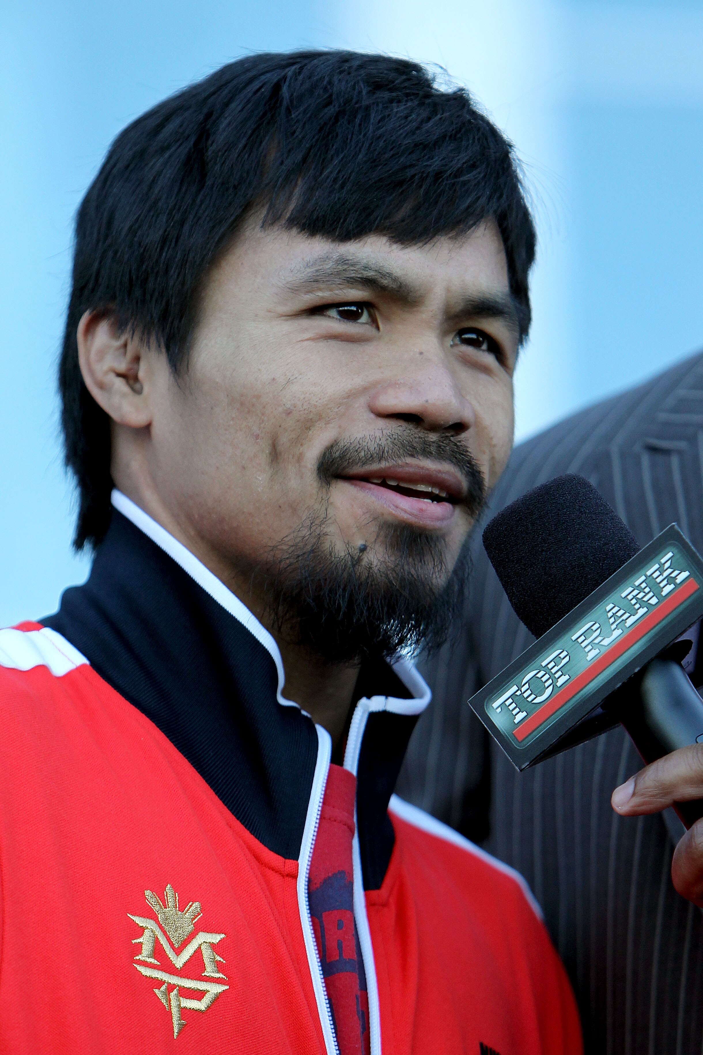 ARLINGTON, TX - MARCH 12:  Manny Pacquiao of the Philippines smiles after he steps on the scale during the weigh-in for his WBO welterweight title fight against Joshua Clottey of Ghana outside Cowboys Stadium on March 12, 2010 in Arlington, Texas. Pacquia