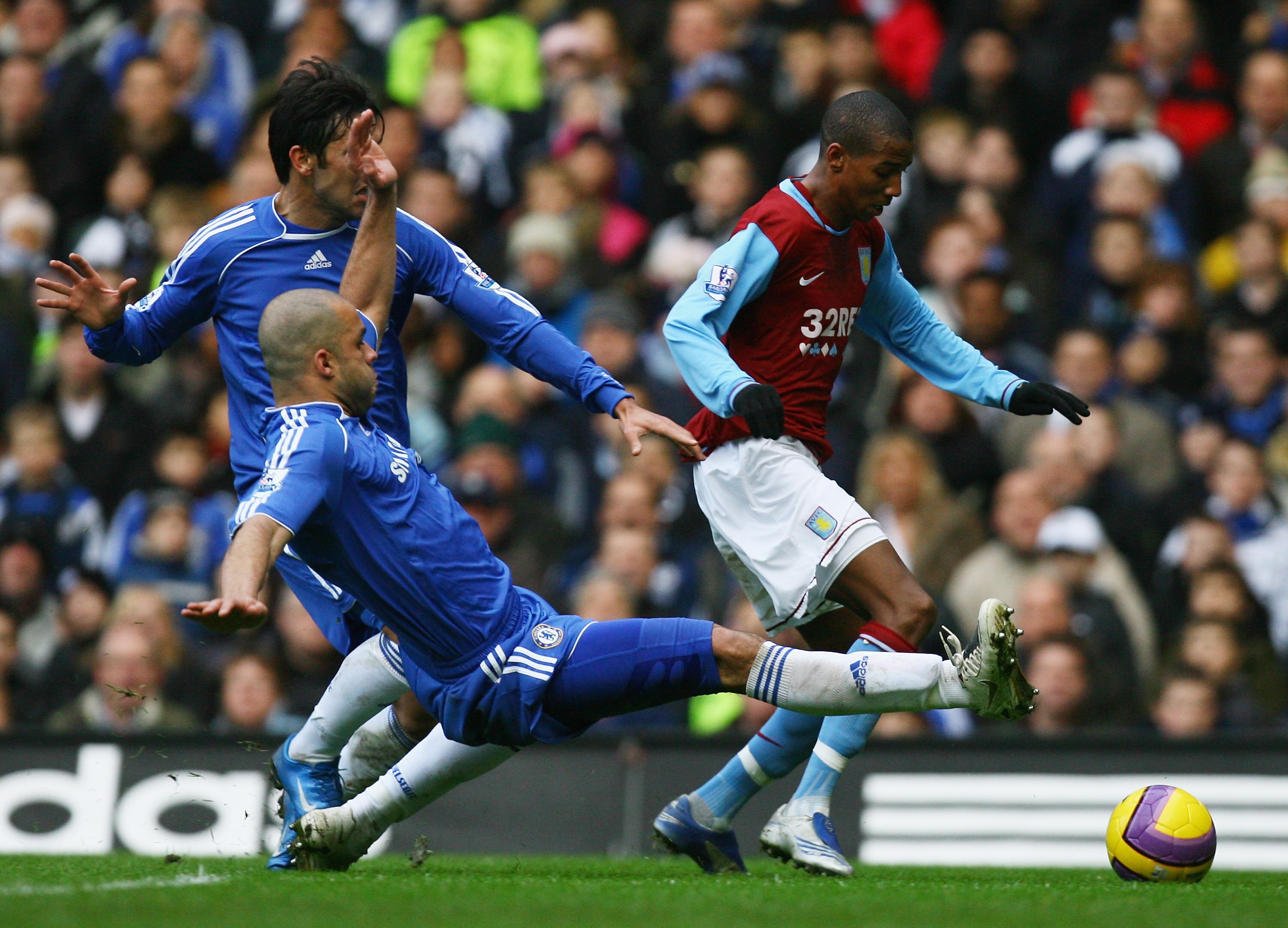 LONDON - DECEMBER 26:  Ashley Young of Aston Villa is tackled by Alex of Chelsea during the Barclays Premier League match between Chelsea and Aston Villa at Stamford Bridge on December 26, 2007 in London, England.  (Photo by Ian Walton/Getty Images)