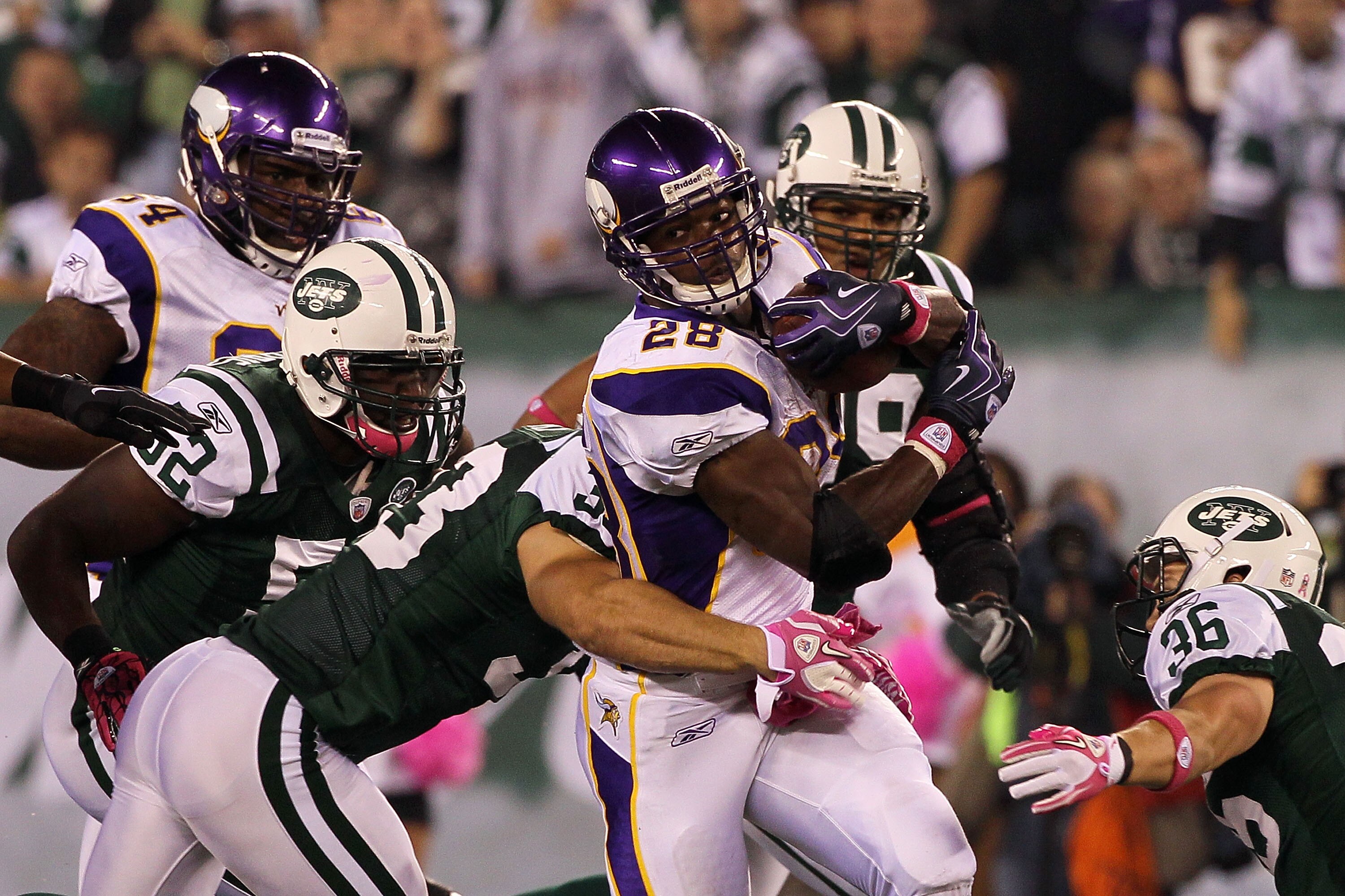 EAST RUTHERFORD, NJ - OCTOBER 11:  Adrian Peterson #28 of the Minnesota Vikings runs the ball in the first quarter against the New York Jets at New Meadowlands Stadium on October 11, 2010 in East Rutherford, New Jersey.  (Photo by Jim McIsaac/Getty Images