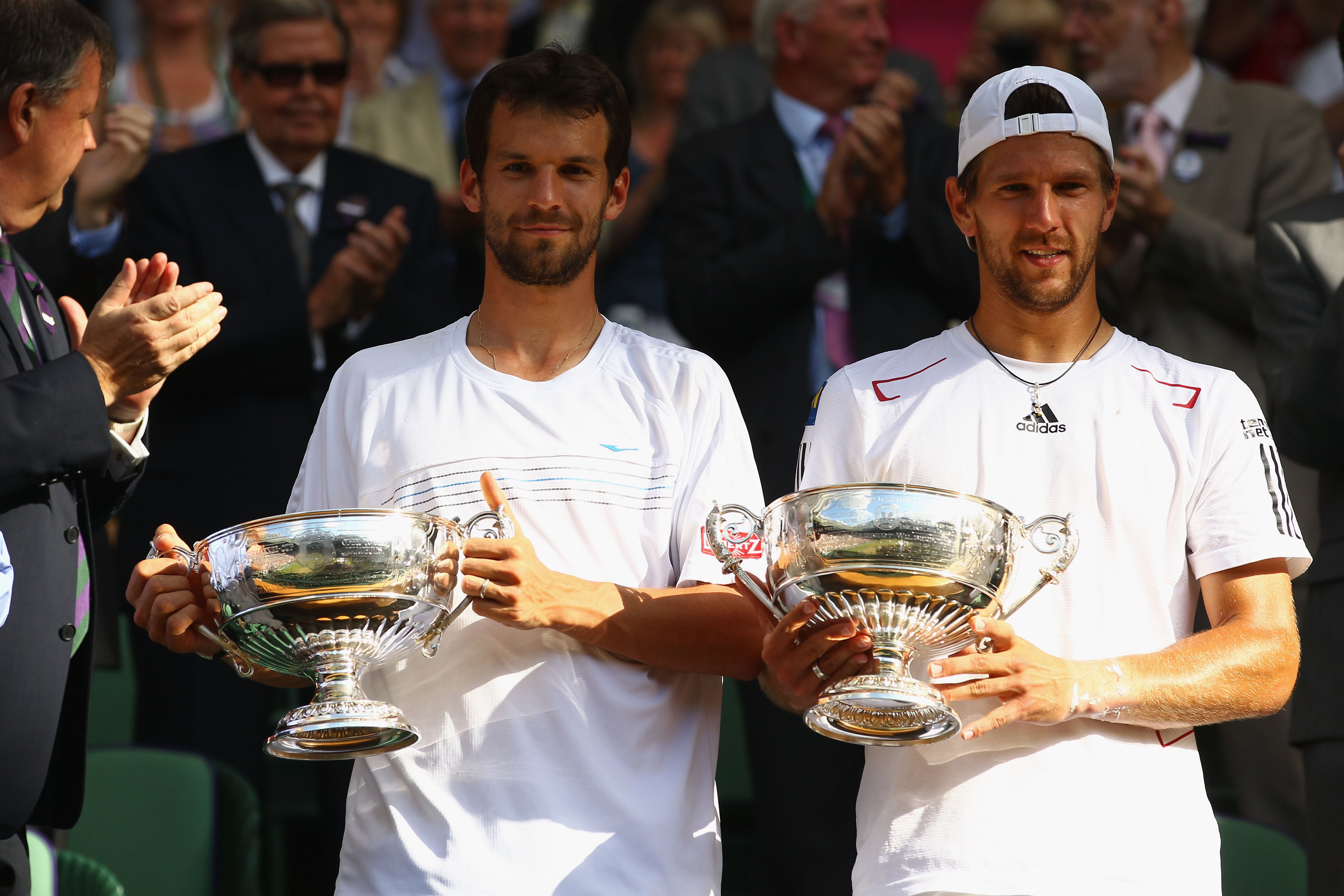 LONDON, ENGLAND - JULY 03:  Jurgen Melzer of Austria (R) and Philipp Petzschner of Germany celebrate after winning the Mens Doubles Final against Robert Lindstedt of Sweden and Horia Tecau of Romania on Day Twelve of the Wimbledon Lawn Tennis Championship