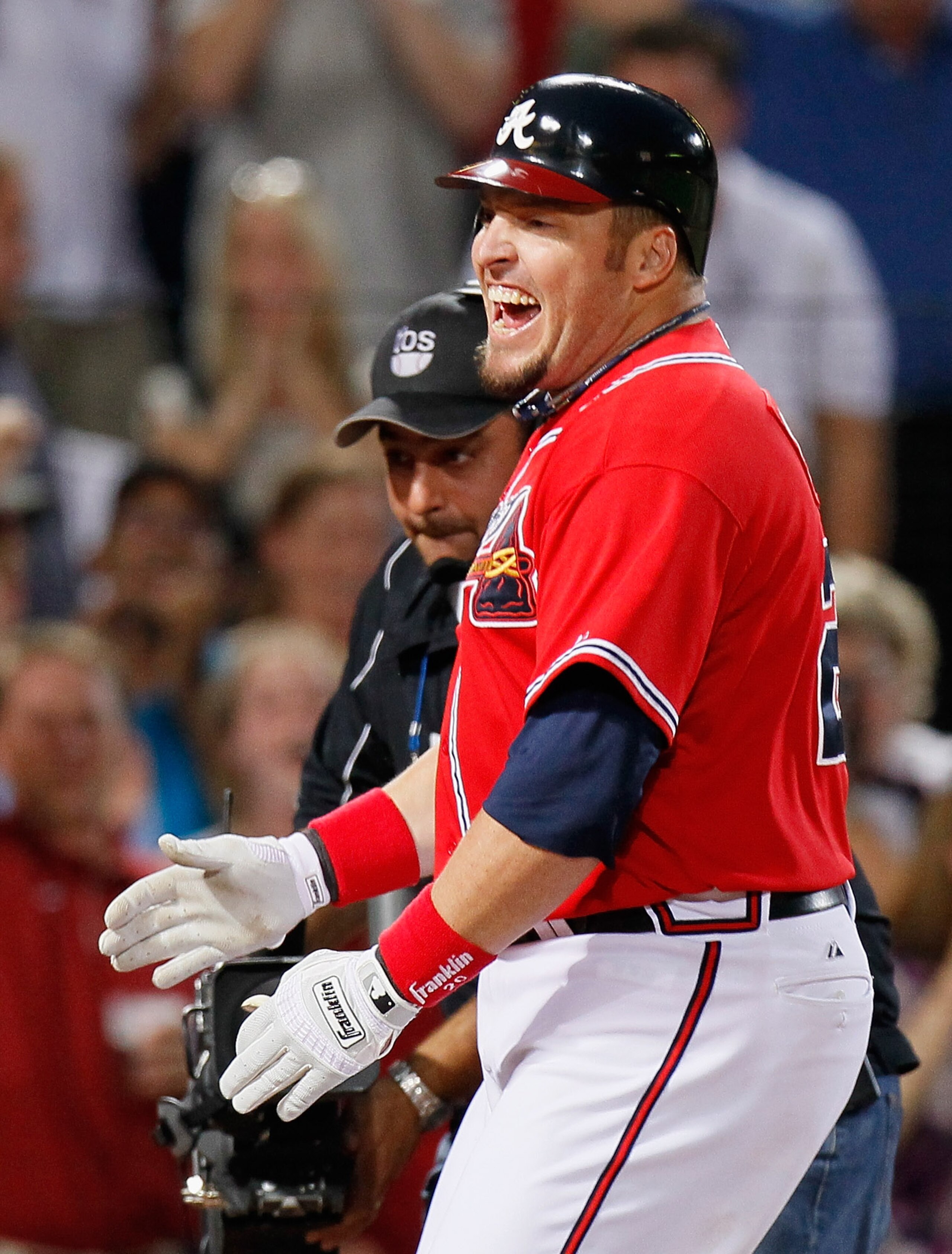 ATLANTA - OCTOBER 10:  Eric Hinske #20 of the Atlanta Braves crosses homeplate after hitting a two-run homer in the eighth inning off pitcher Sergio Romo #54 of the San Francisco Giants during Game Three of the NLDS of the 2010 MLB Playoffs at Turner Fiel