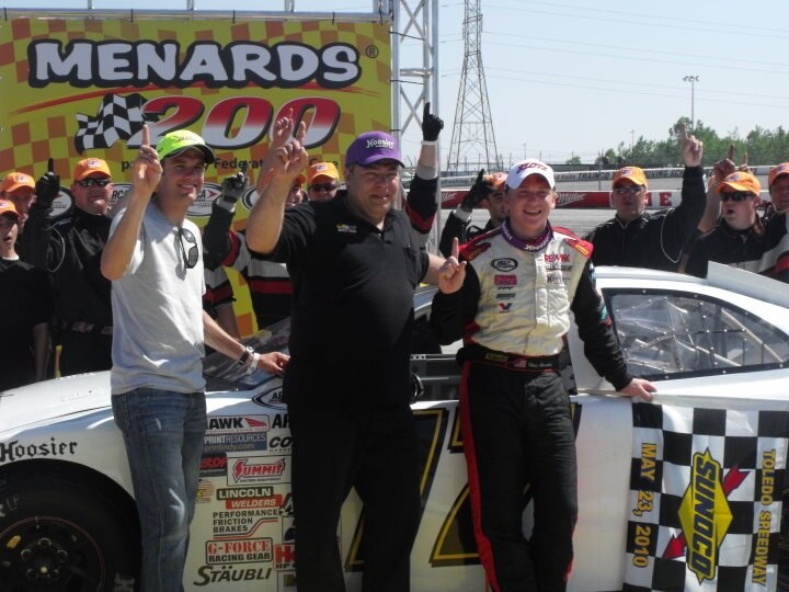 Chris Buescher along with David Ragan and crew chief in victory lane / (C)Ashley McCubbin